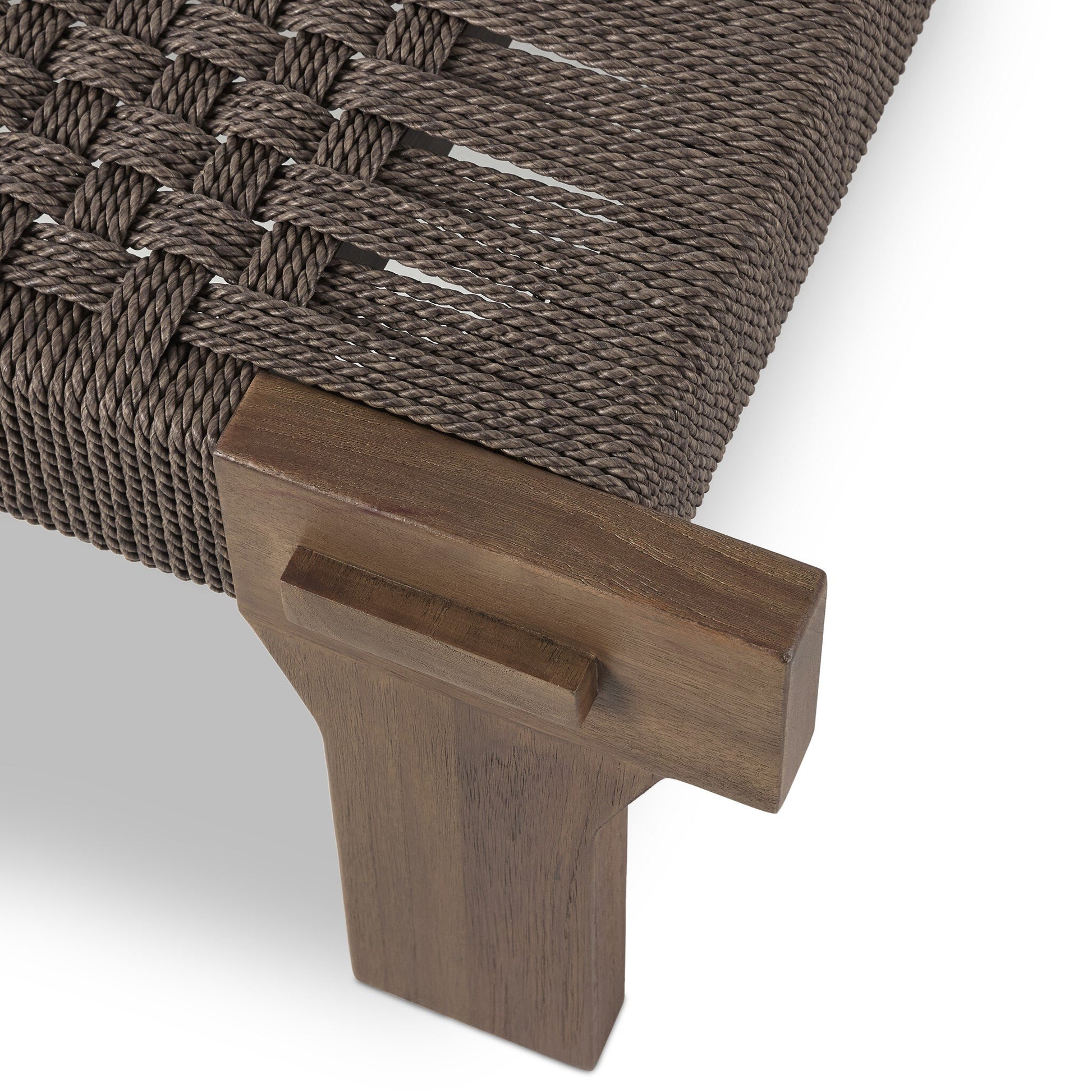 Close-up of the FSC Teak Woven Detail | Outdoor Bench, featuring a solid teak leg and frame with tightly woven brown rope forming a textured crisscross seat; the smooth, polished wood is ideal for outdoor use.