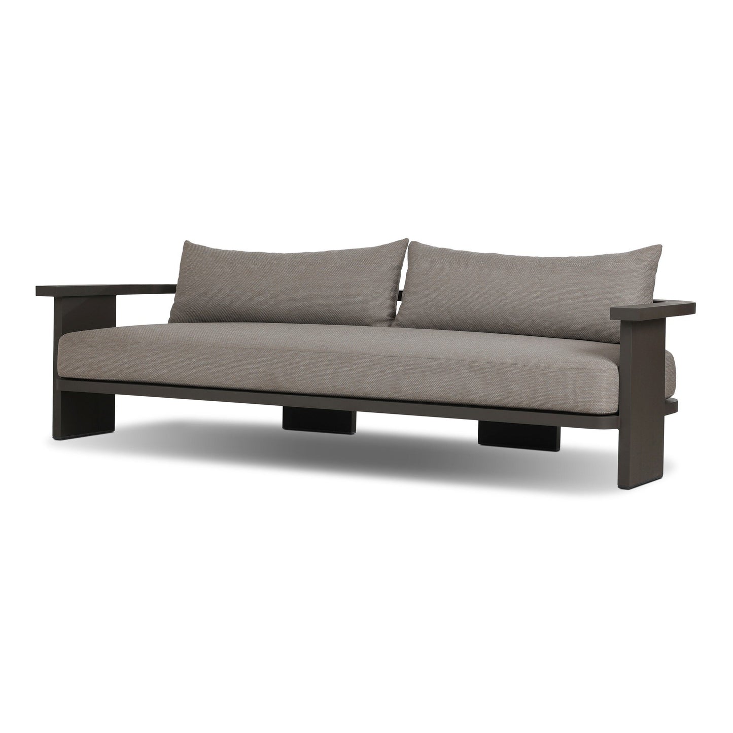 The Aluminum Wide-Frame Outdoor Sofa has a minimalist design with a sturdy aluminum frame, wide armrests, and light gray Italian upholstery. Its clean, low profile and high-performance fabric cushions provide comfort and lasting style.
