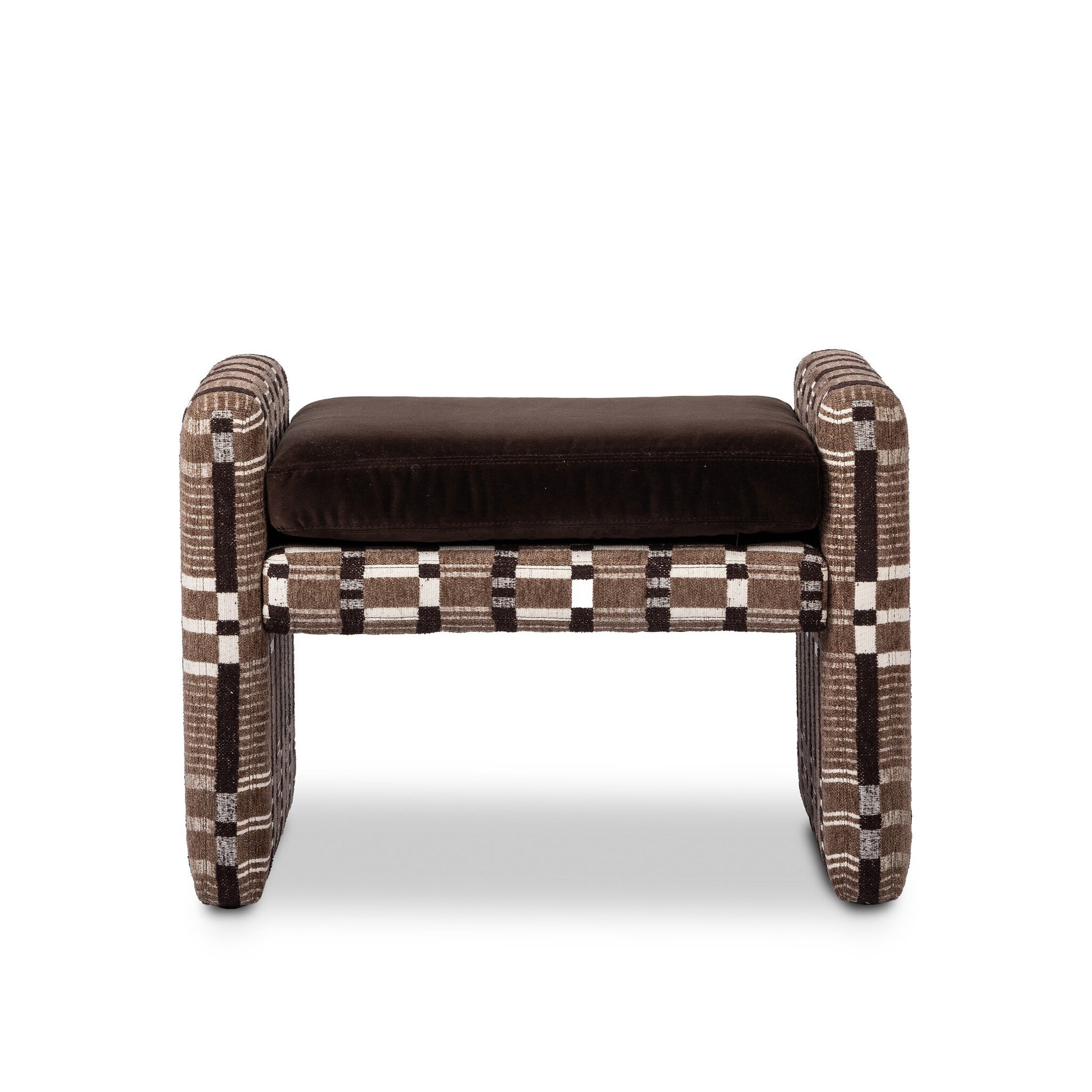 The Serena Ottoman features a brown cushioned seat and thick rectangular armrests with a plaid pattern in brown, beige, and white. Its dimensions are 18.00"d x 26.00"w, shown against a white background.