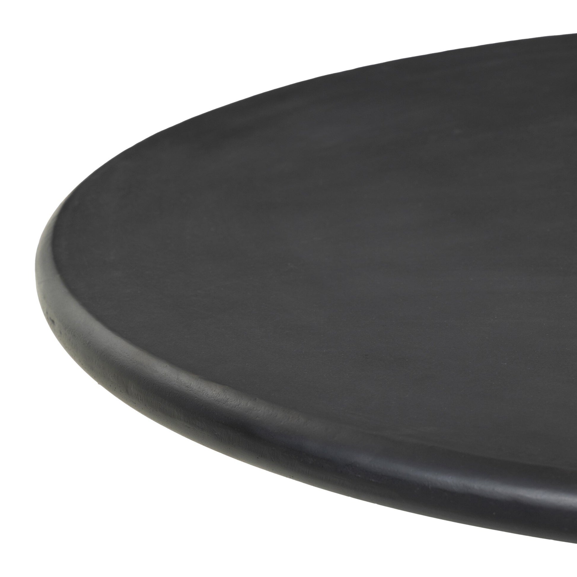 A close-up of the edge of the Aluminum Sculptural Pedestal | Outdoor Table, a round black table with a smooth surface, shown against a white background.