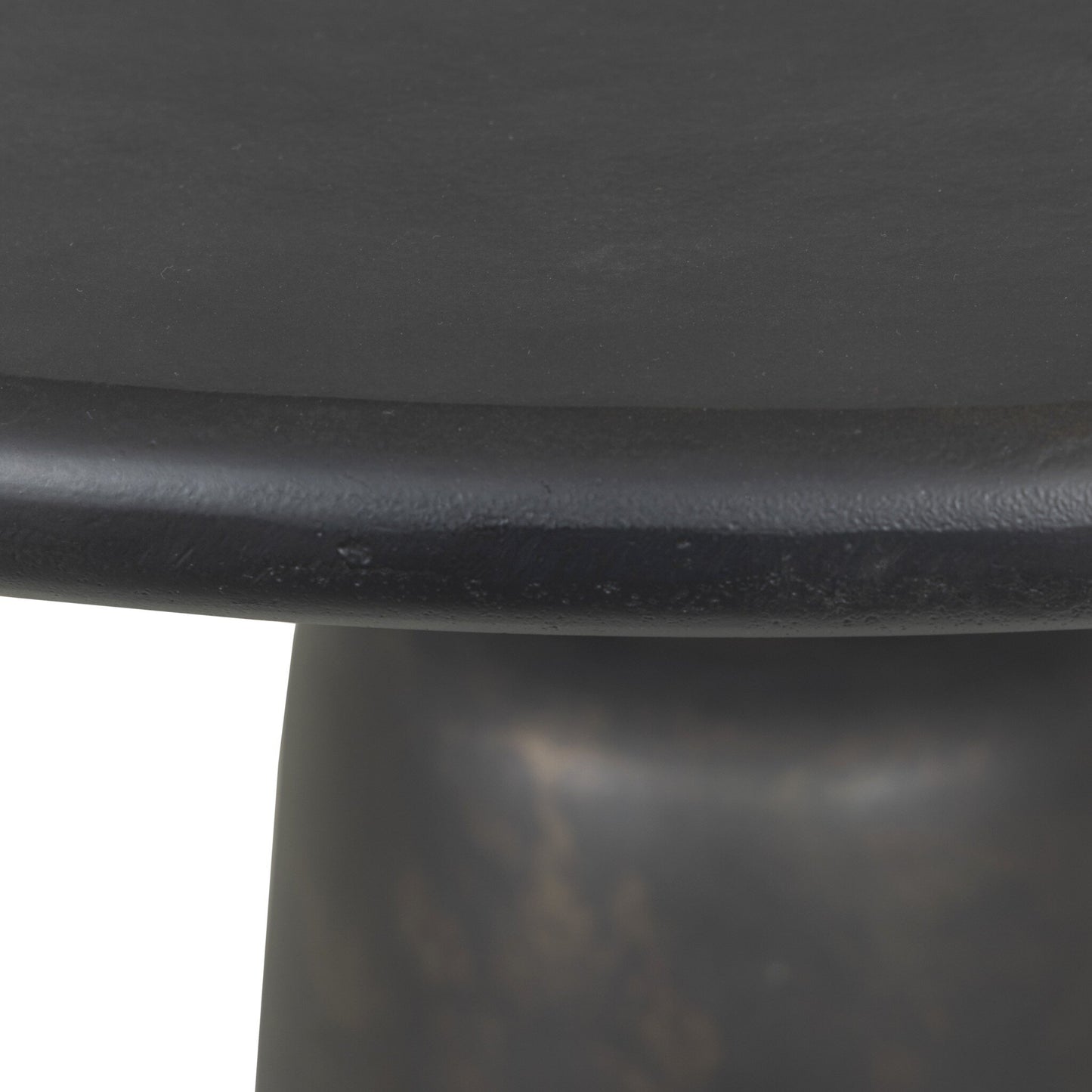 Close-up of the edge and side of the Aluminum Sculptural Pedestal | Outdoor Table, featuring a smooth matte finish in distressed bronze, photographed against a white background.