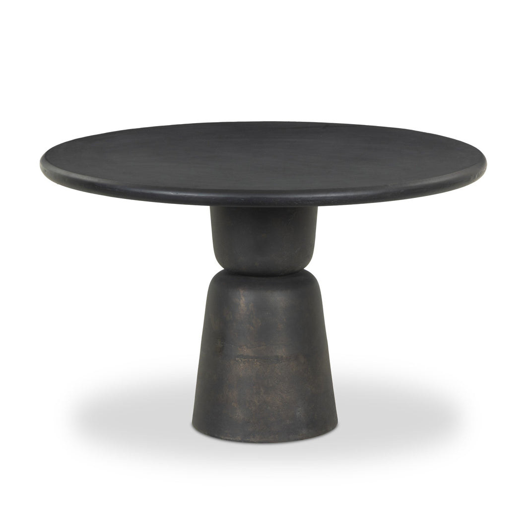 The Aluminum Sculptural Pedestal | Outdoor Table features a round, black top and a geometric two-tiered base, making it ideal as a stylish outdoor table for modern settings.