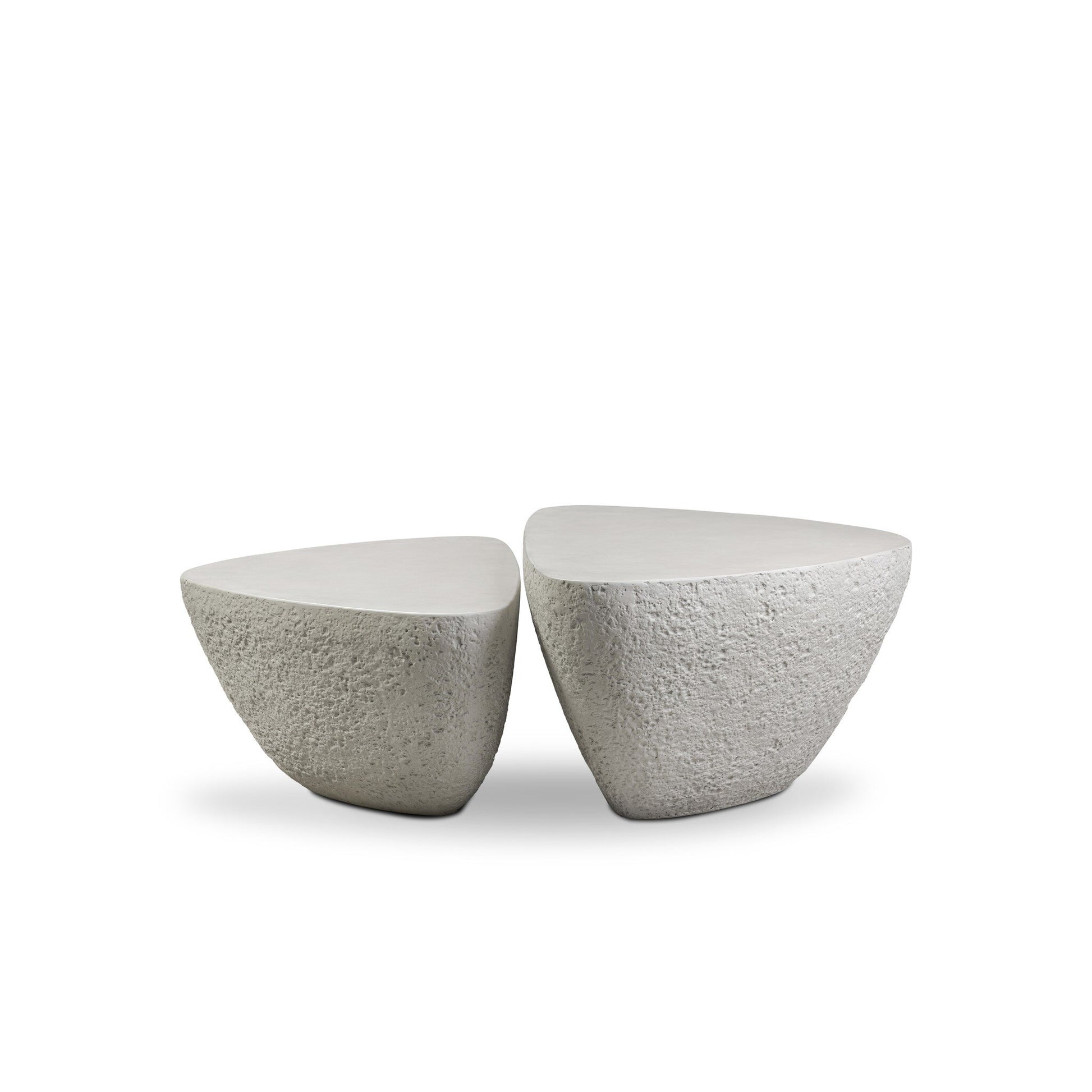 Two Concrete Organic Nesting Outdoor Coffee Tables with smooth white tops and textured stone-like sides are placed side by side on a white background.