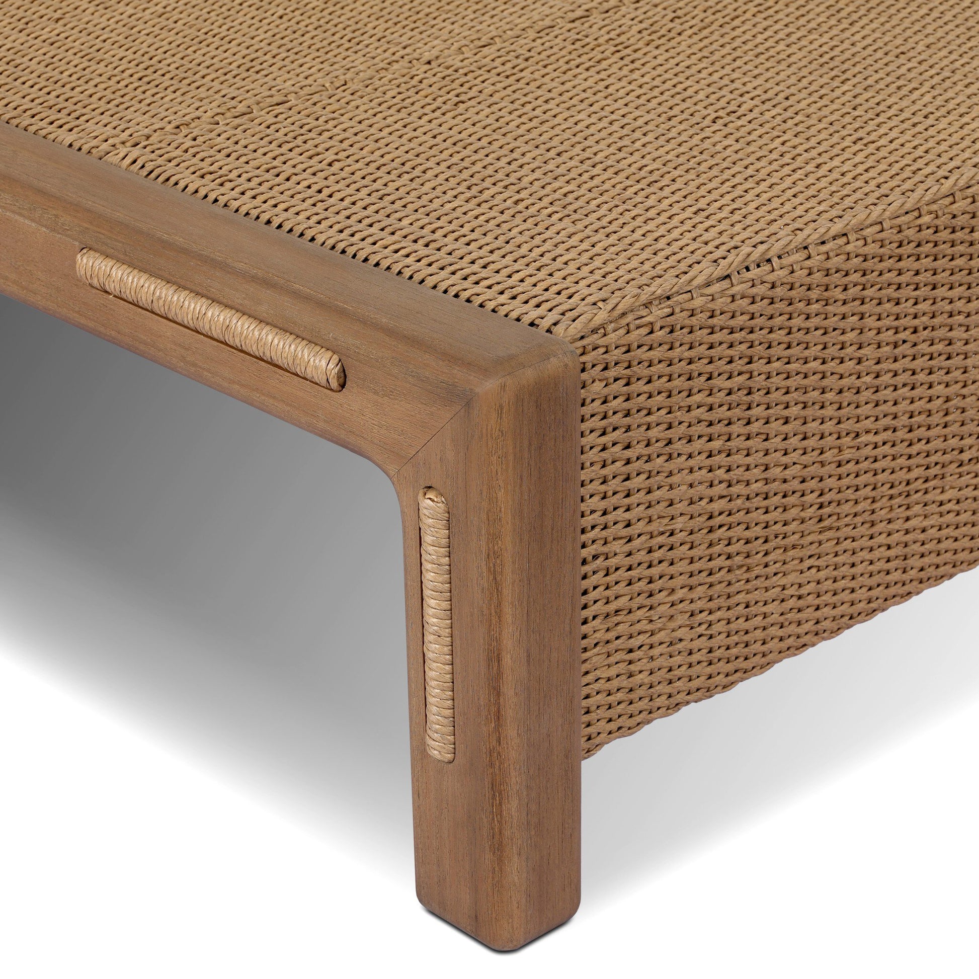 Close-up of the FSC-Certified Teak Woven Slats Outdoor Coffee Table, showcasing its wooden frame, integrated rope detail, mock-slat design, and fine craftsmanship against a white background.