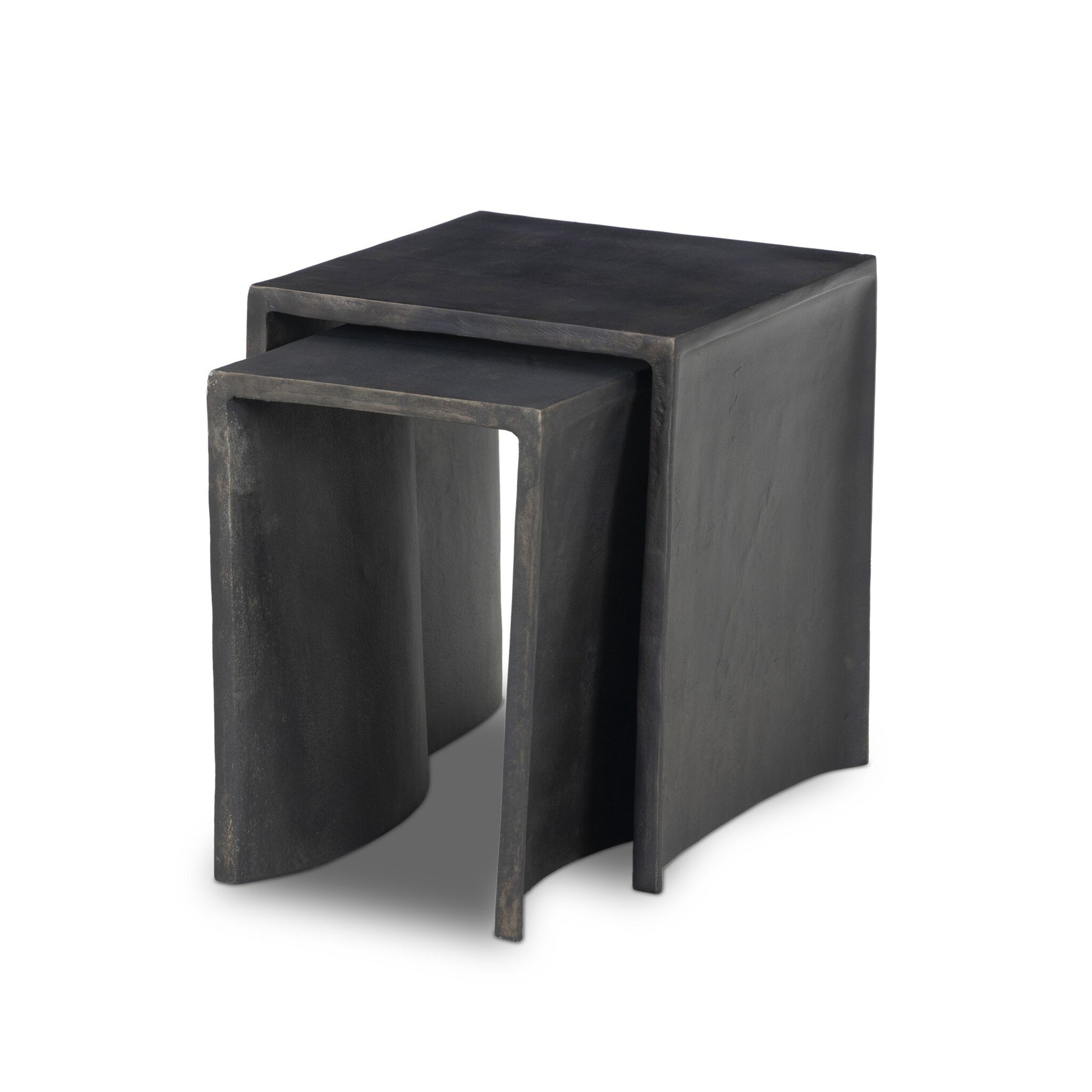 The Aluminum Curved Legs | Outdoor Nesting End Tables feature two modern, black cast aluminum tables with smooth surfaces and unique curved legs. The smaller table can be partially nested under the larger for a sculptural, minimalist look.