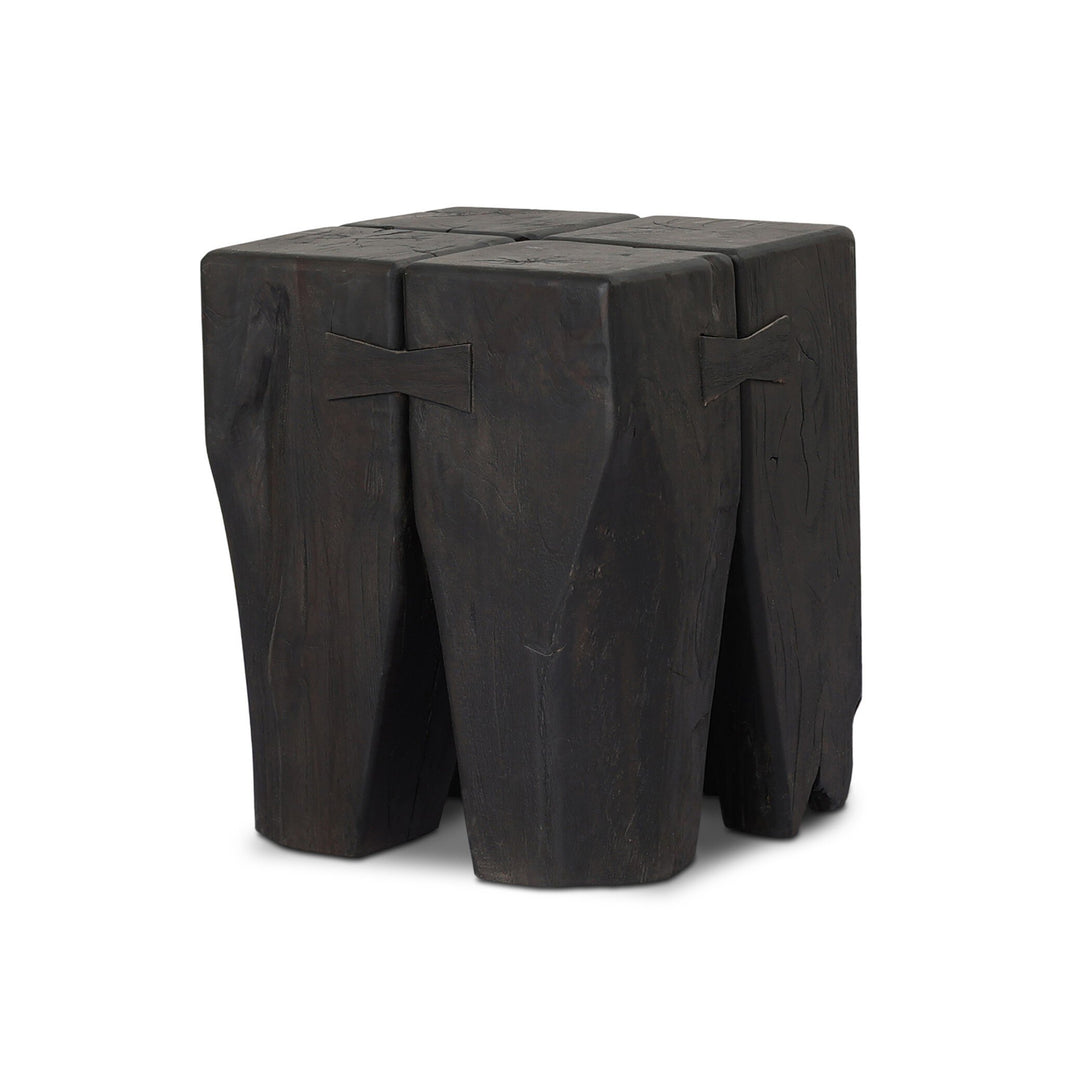 The FSC Teak Tiered Pillar Outdoor End Table features a dark solid teak build with a square top, chunky uneven legs, and butterfly joint accents for a rustic handmade look—ideal as an outdoor end table or unique accent piece.