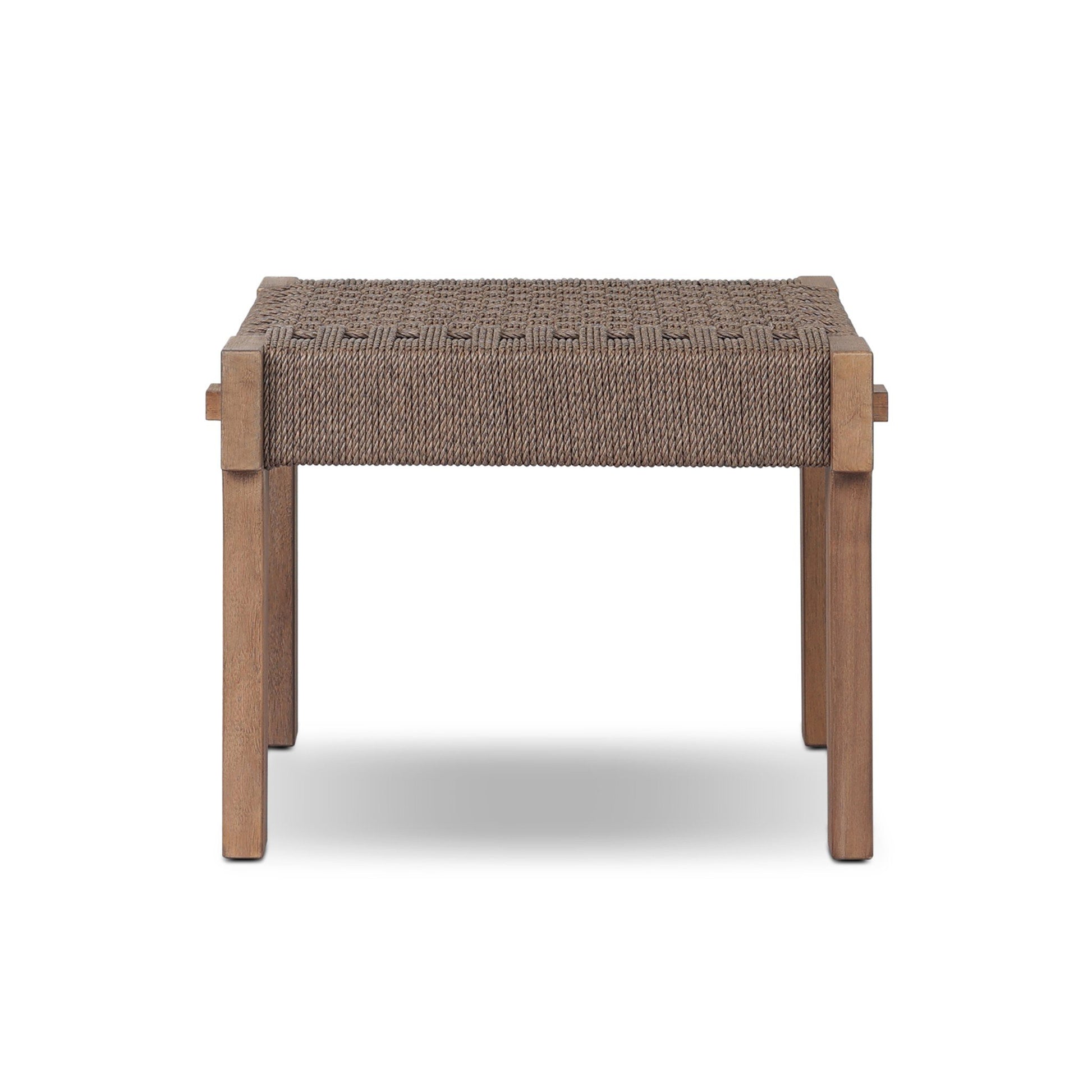 The Woven Teak | Handcrafted Outdoor Accent Stool features a solid rectangular teak frame with four legs and a brown woven rope seat, displayed against a plain white background.