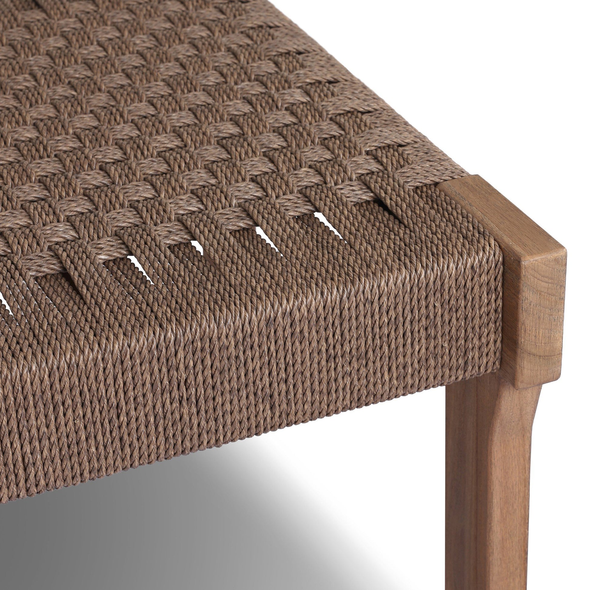 Close-up of the Woven Teak Handcrafted Outdoor Accent Stool, featuring a detailed woven rope seat and sturdy wooden frame that highlights the quality texture and craftsmanship of this stylish outdoor furniture piece.