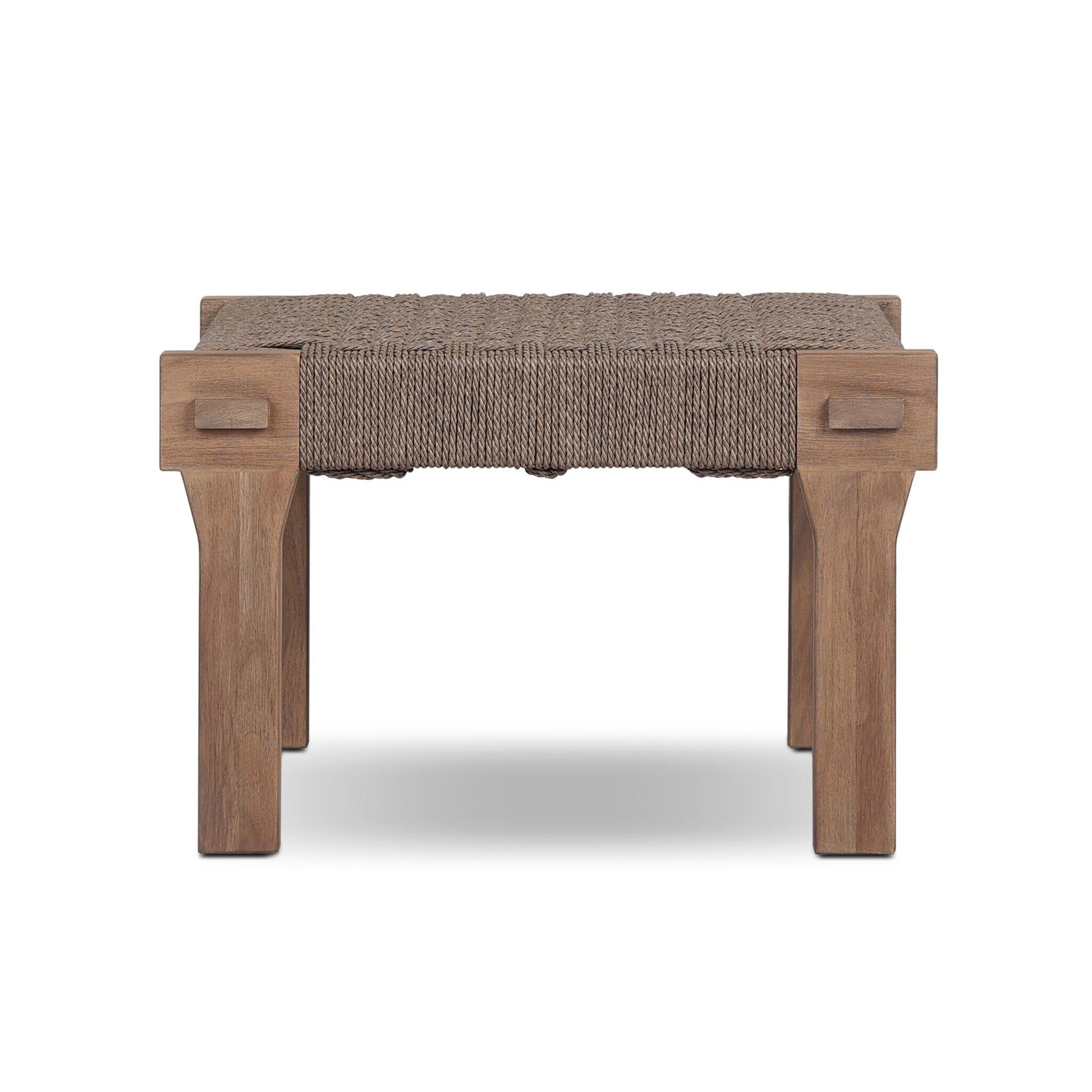The Woven Teak | Handcrafted Outdoor Accent Stool features a solid teak frame with four sturdy legs and a handwoven rope seat, shown here against a white background.