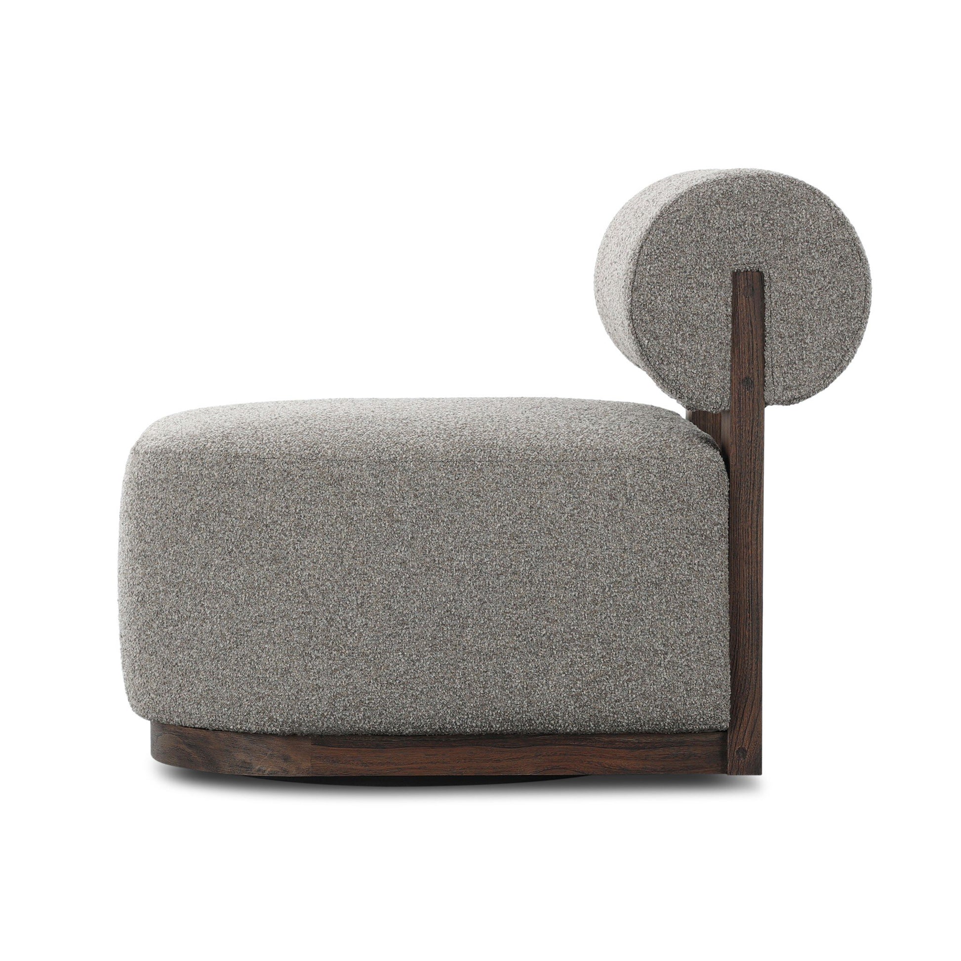 The FSC Teak & Olefin Swivel Outdoor Accent Chair features a round, cushioned gray seat with a matching cylindrical backrest, UV-resistant upholstery, and a sleek dark teak frame on the side and base.