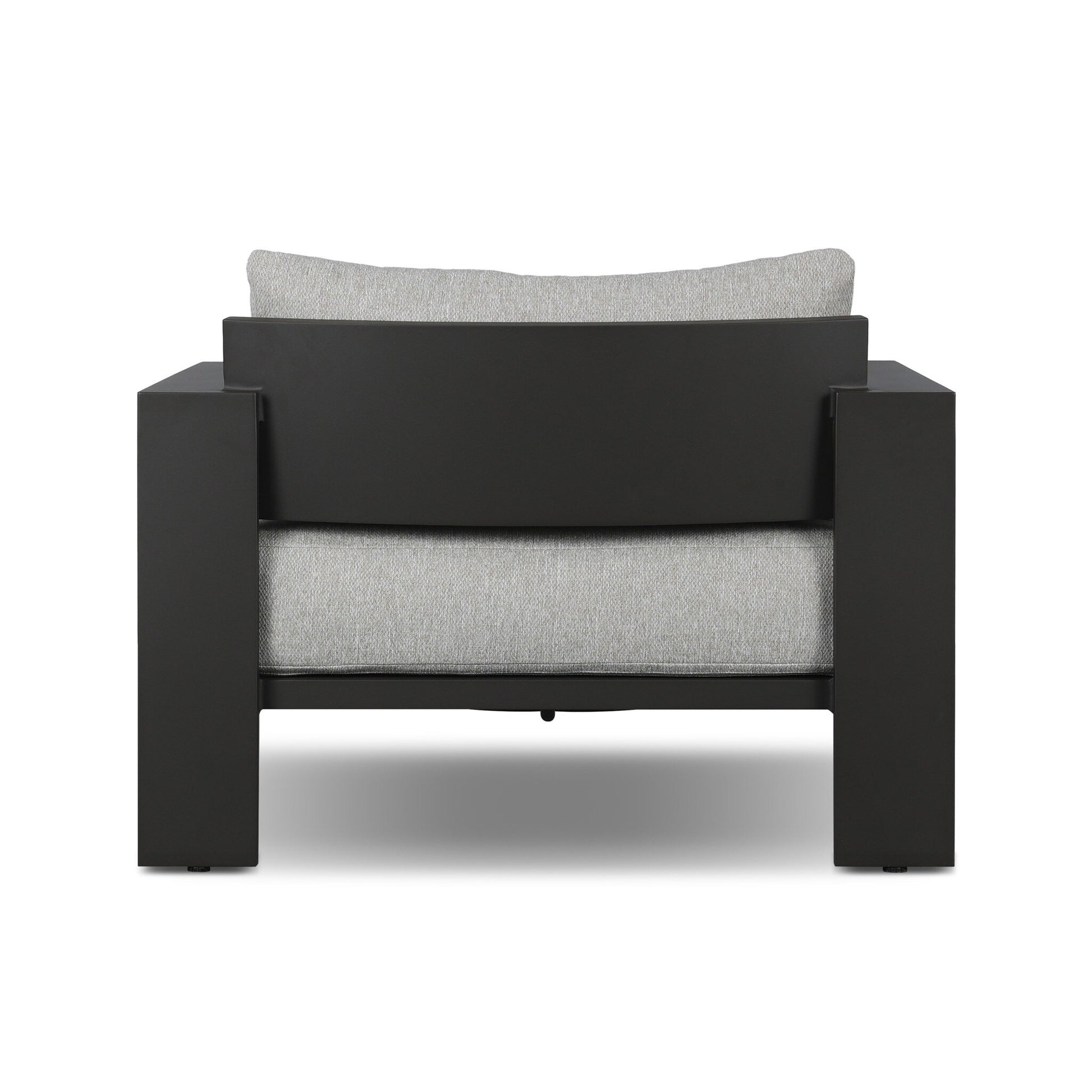 The Aluminum Angular Accent Outdoor Chair features a thick black rectangular frame and light gray cushions. Its minimalist design, sturdy look, and impressive dimensions make it a standout piece when viewed from the back.