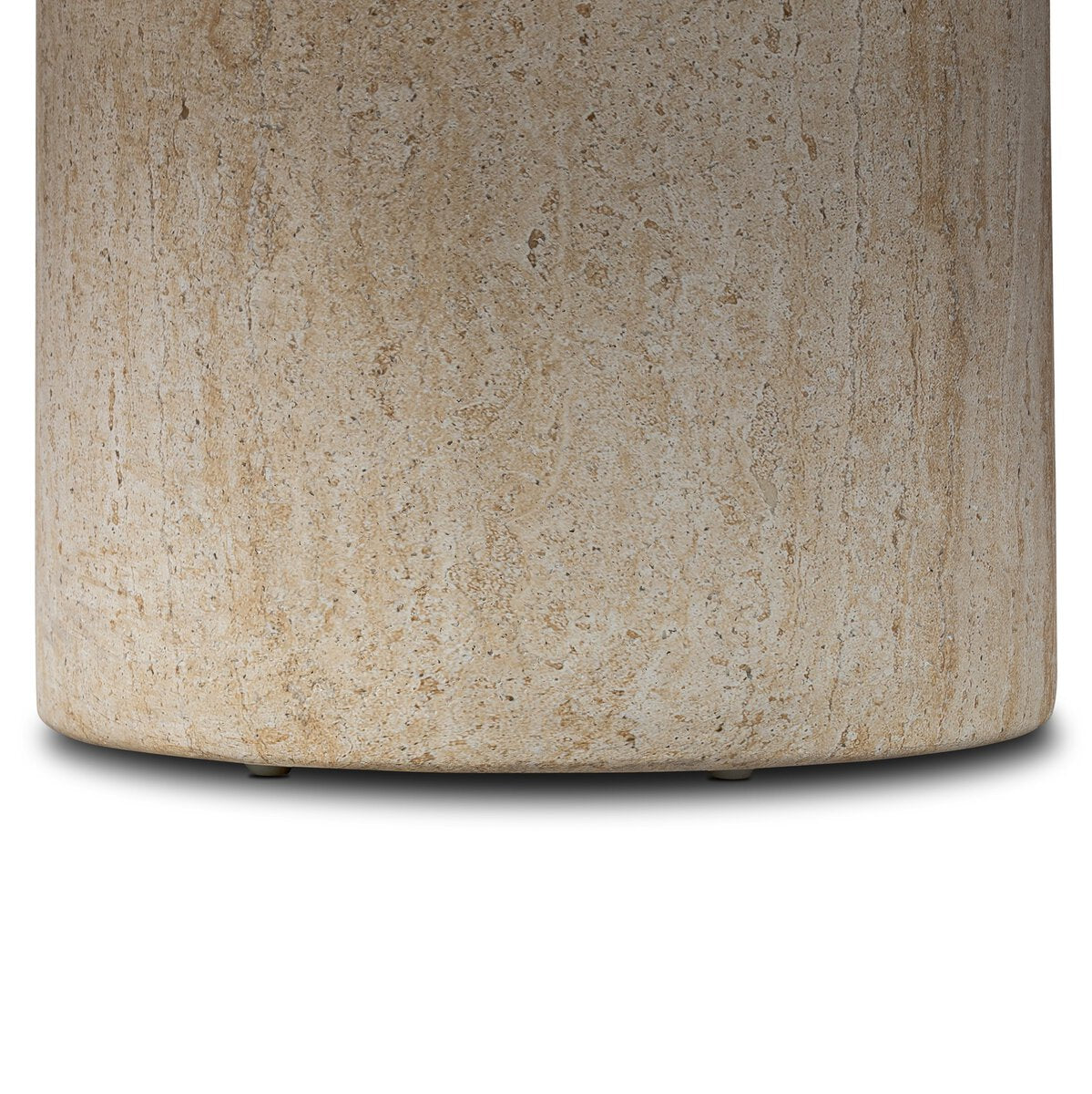 Close-up of the Poole Outdoor Coffee Table base, crafted from light beige textured stone with subtle natural patterns, casting a soft shadow on a white background.