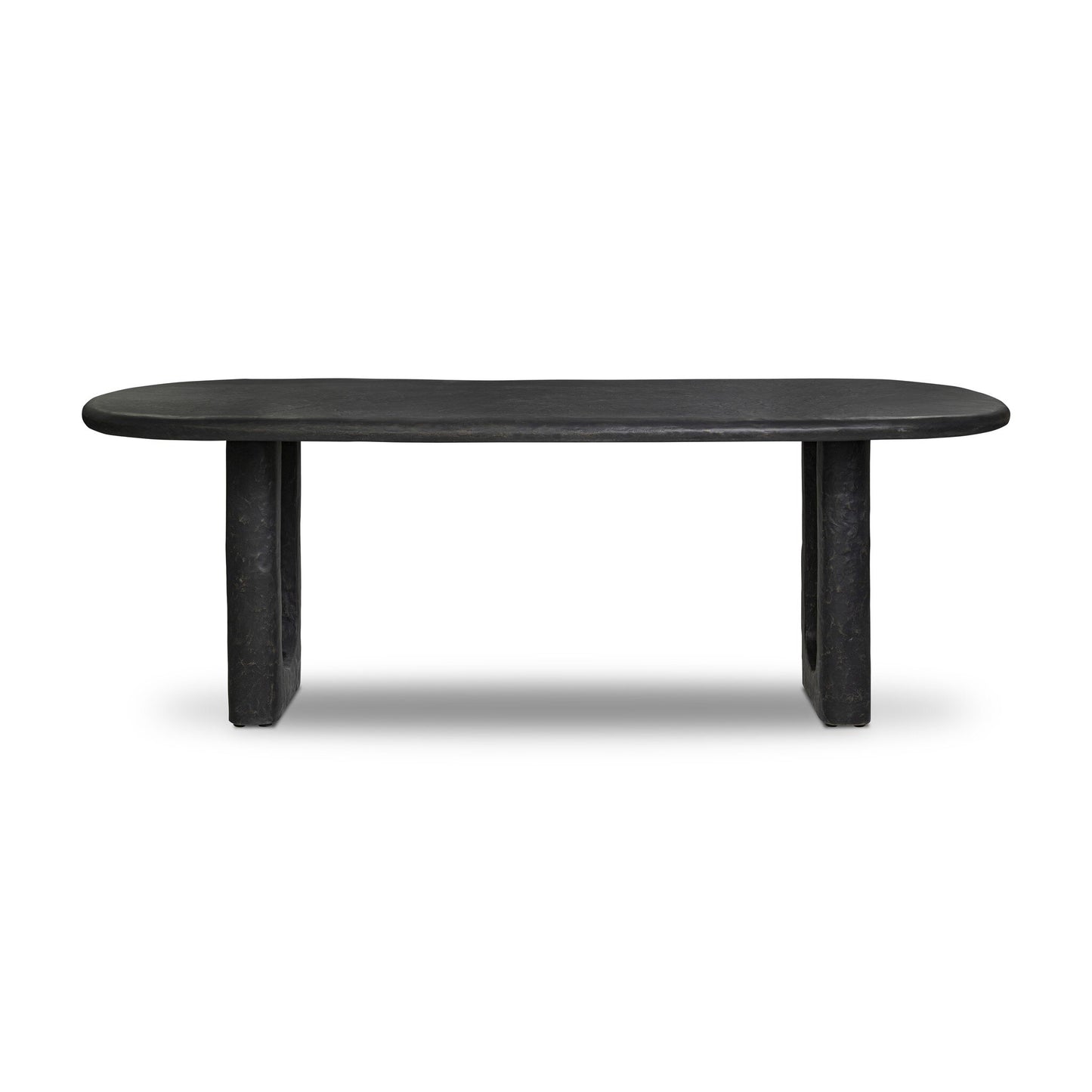The Obsidian Concrete Softened Rectangle Dining Table features a modern black design with an oval-shaped top and two thick obsidian-finished concrete legs, displayed against a plain white background.