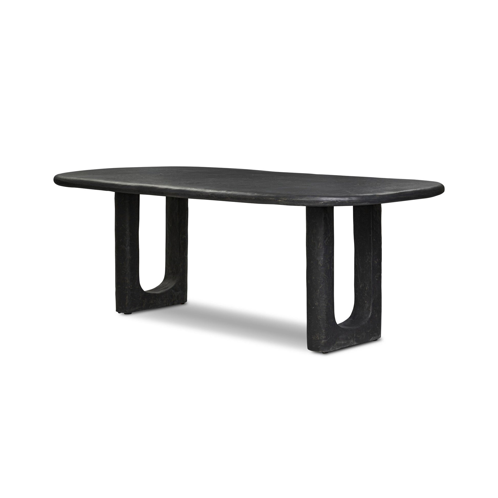 The Obsidian Concrete Softened Rectangle Dining Table features a modern, obsidian-finished concrete top with rounded edges and two wide U-shaped legs.