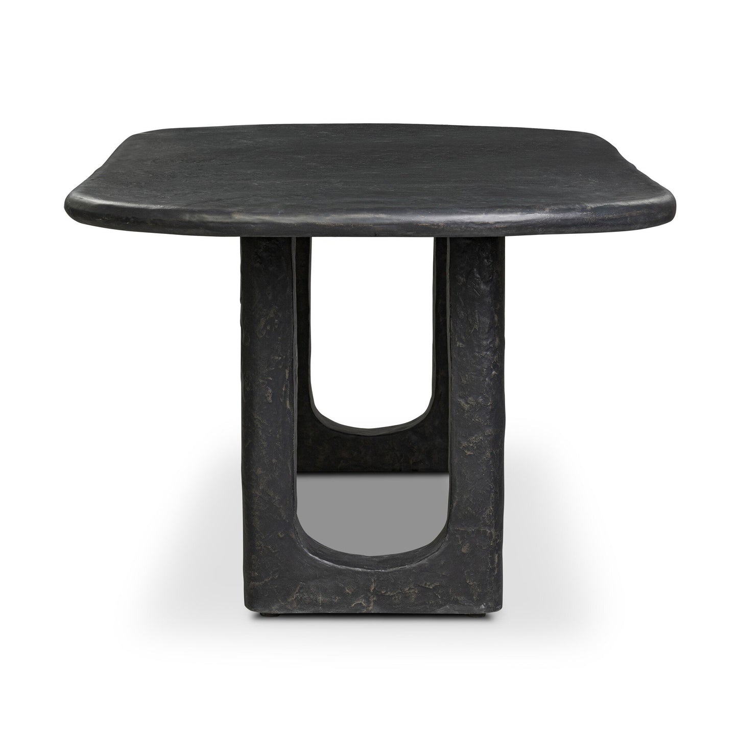 The Obsidian Concrete Softened Rectangle Dining Table features a modern square shape, curved edges, an obsidian-finished concrete base, sculptural central column, and a distinctive open rectangular cutout.