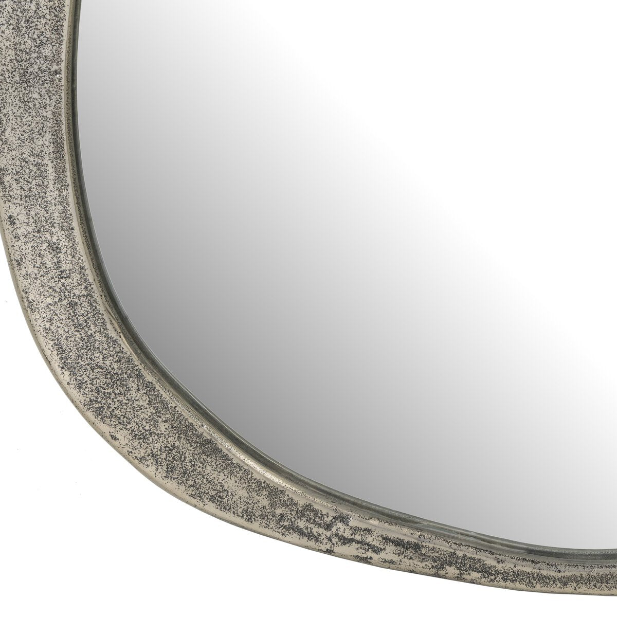 Close-up of the Chavez Wall Mirror, showcasing a slightly curved edge and a textured Raw Antique Nickel frame with a weathered, speckled finish. Overall dimensions: 28.00"w x 31.00"h.