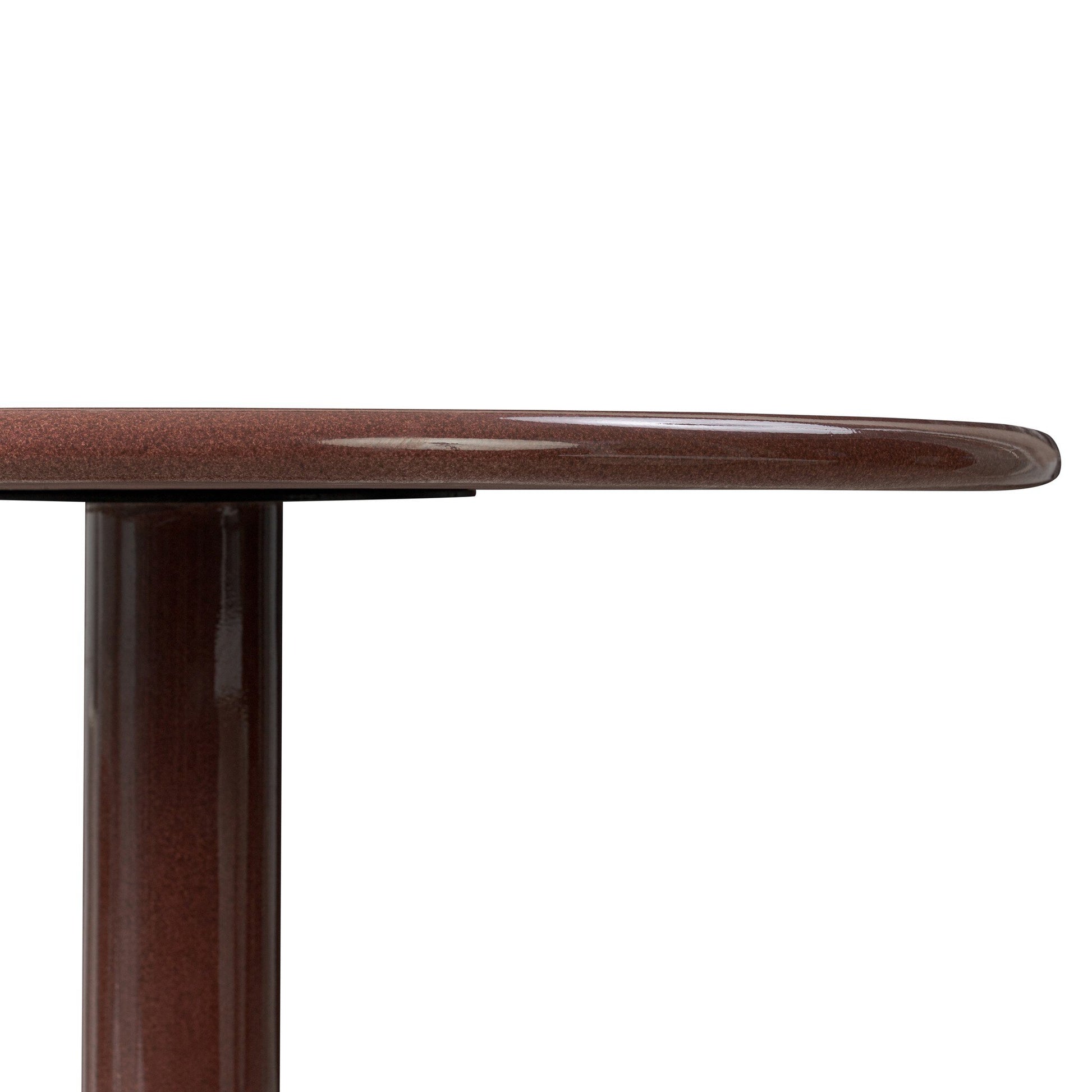 A close-up side view of the Solid Concrete Rounded Top | Dining Table, featuring a smooth round surface and a single cylindrical leg, set against a white background.