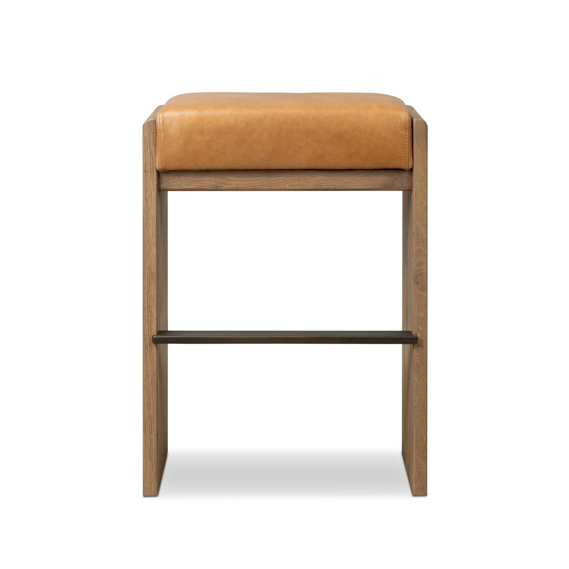 The Nash Bar + Counter Stool features a tan leather cushion and wooden frame, pictured front-facing on a white background. Its sleek design fits perfectly in modern kitchens and dining spaces as a stylish counter stool.