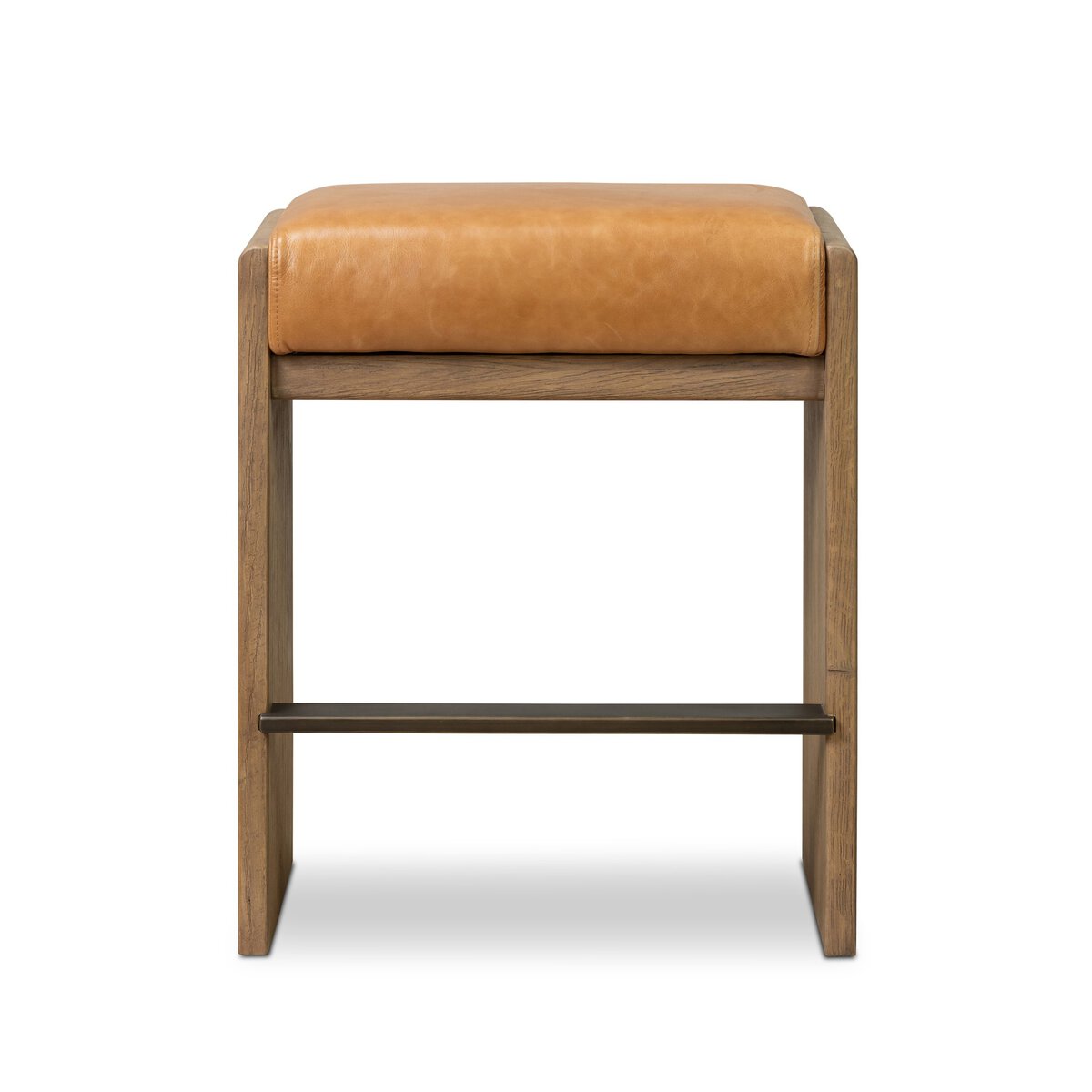 The Nash Bar + Counter Stool features a tan leather upholstered seat, wooden frame, metal footrest, and sleek rectangular design—perfectly sized for modern spaces.