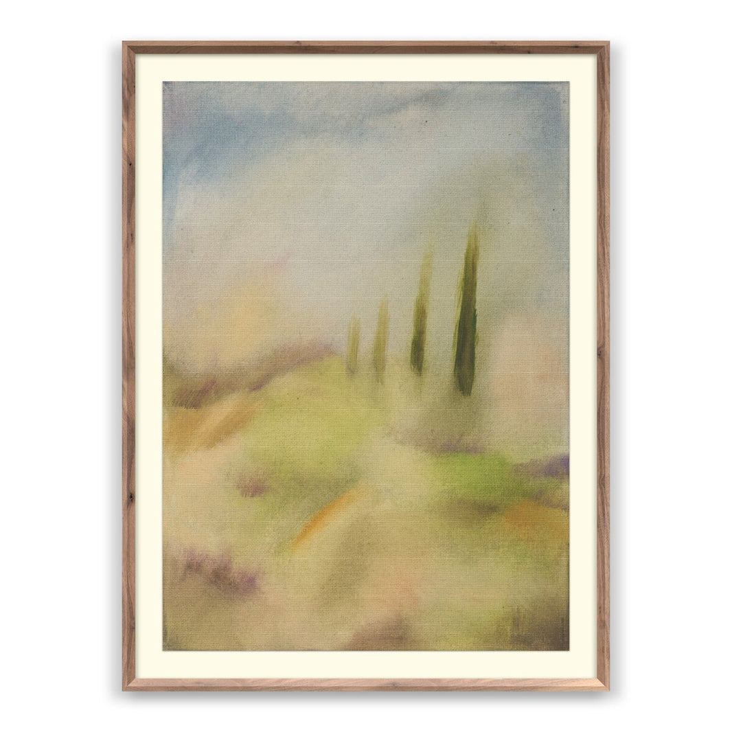 Framed 30″ x 40″ “Tuscan” by Jess Engles features a hazy landscape in soft pastel colors, with three tall, slender green trees on gentle rolling hills beneath a light blue sky, creating a dreamy, impressionistic effect.