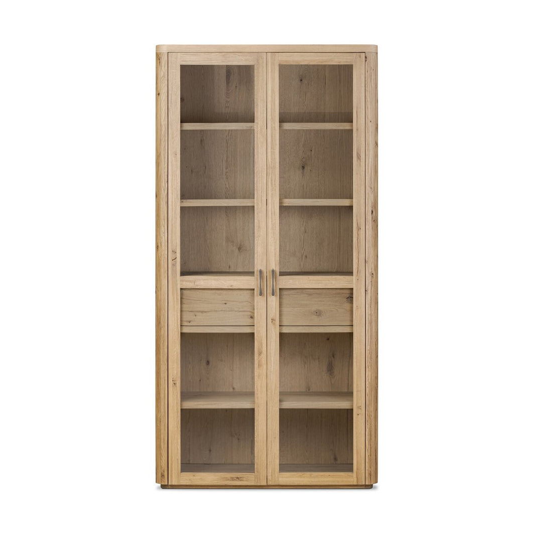The Smoked Oak Cabinet is a tall wooden bookcase with glass-paneled double doors, metal handles, and multiple interior shelves—elegant storage or display in a 42-inch design.