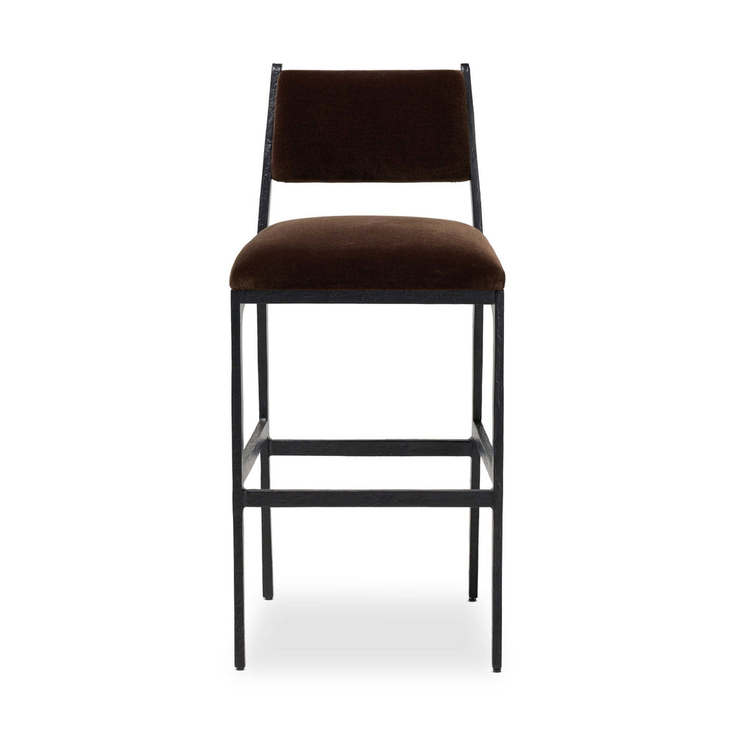 The Valeene Bar Stool features a dark brown cushioned seat and backrest, a sleek black metal frame with footrest, and measures 19.00"w x 21.75"d x 42.00"h. Shown front-facing against a white background.