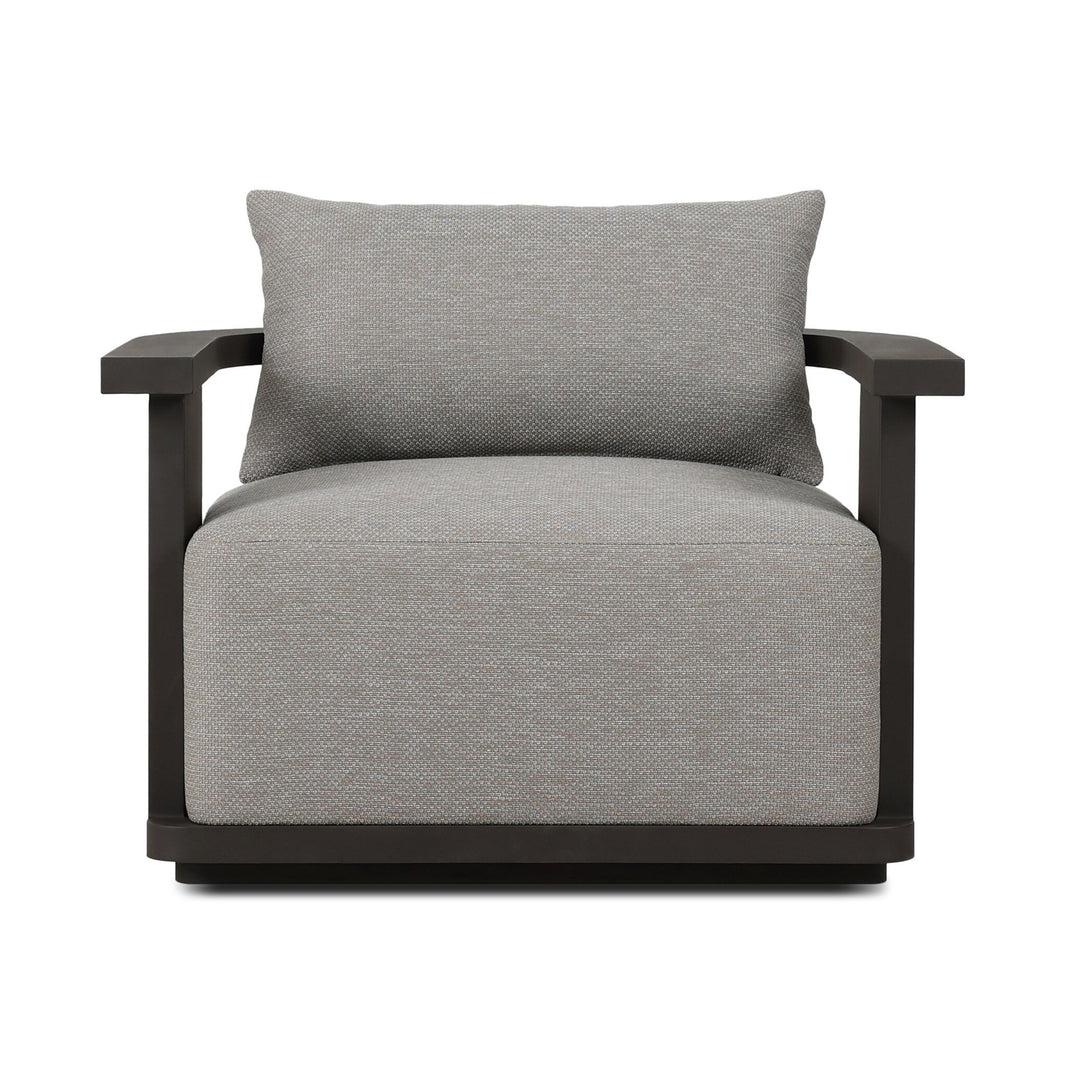 The Aluminum Swivel Outdoor Armchair has a modern, boxy design with light gray high-performance fabric, wide dark wooden armrests and frame, a matching rectangular back cushion, and a low, wide seat.