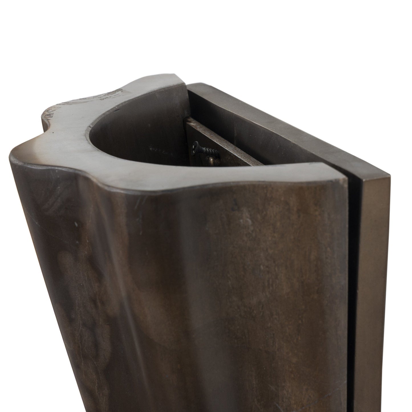 Close-up view of the Astra Sconce, a sculpted dark metal fixture with a smooth, curved edge and rectangular back, featuring overall dimensions of 8.50w x 4.50d x 7.75h.