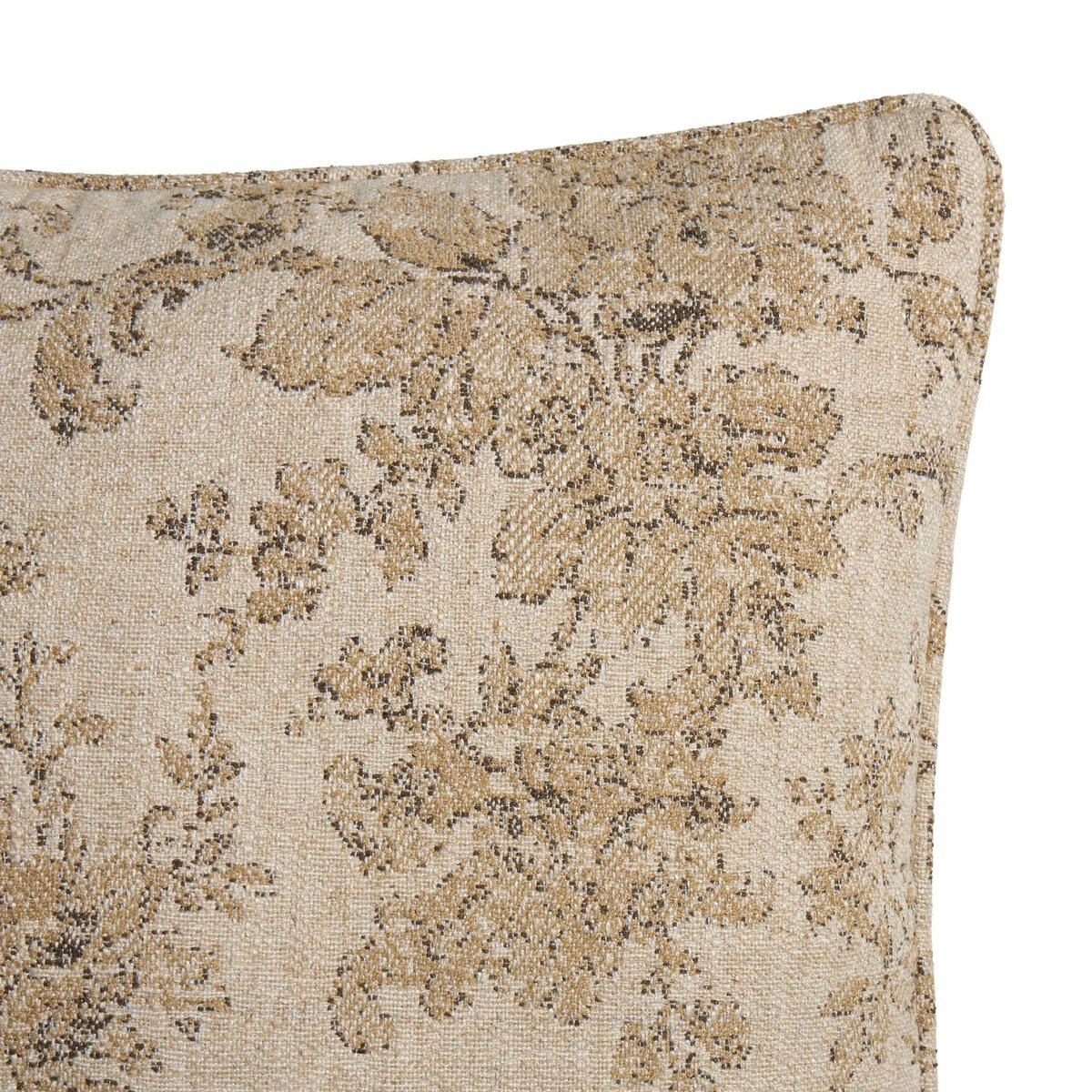 Close-up of the April Pillow's corner, showcasing its textured beige fabric and intricate floral pattern in muted brown and gold—an elegant accent for your home decor.