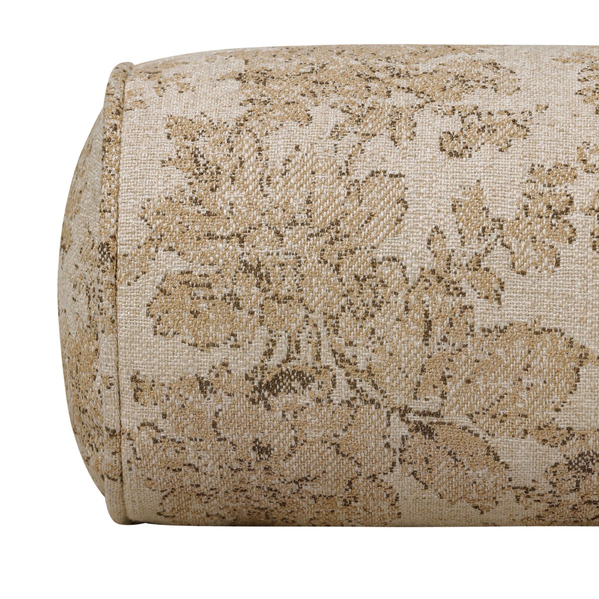 The April Bolster Pillow, a cylindrical beige cushion with a subtle light brown and tan floral fabric cover, rests elegantly on a wooden floating shelf.
