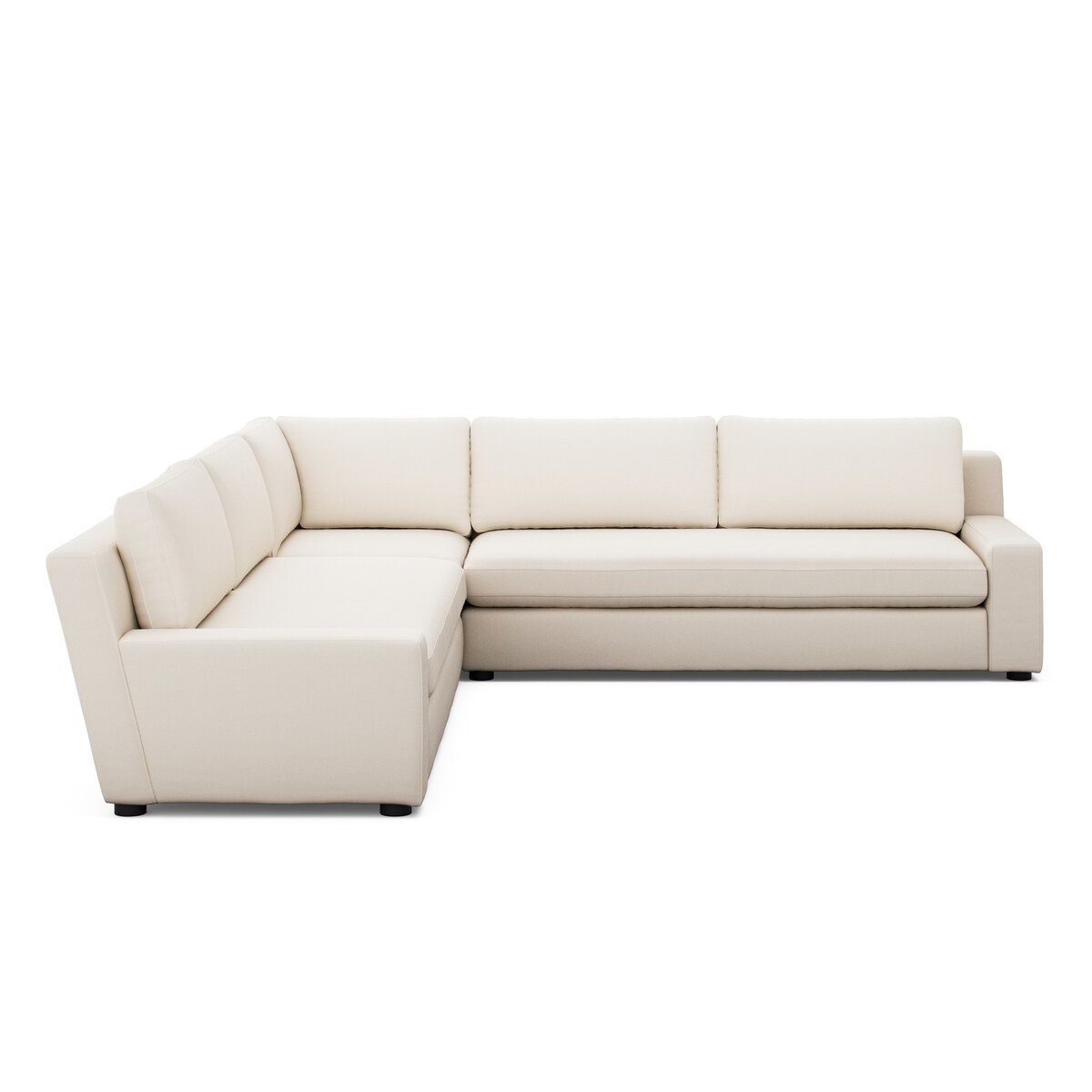 The Track Arm Modular Sectional, an L-shaped modern sofa in light beige upholstery with clean lines, track arms, and plush foam cushions, is set against a white background for a sleek contemporary appearance.