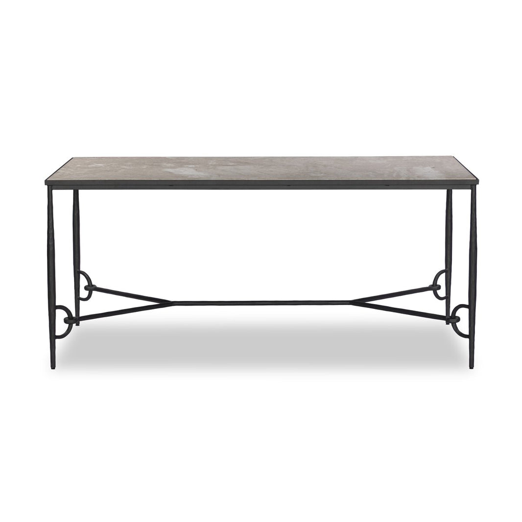 The Babylon Desk is a rectangular table with a light tabletop and black metal frame, featuring decorative curved side supports. Perfect as a sofa table, it measures 68 inches wide overall.