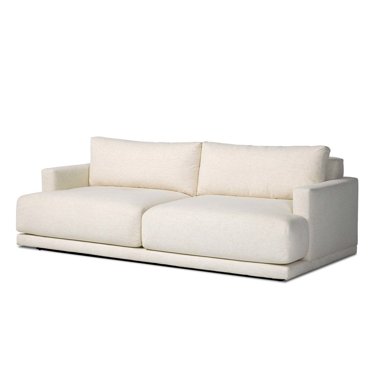 The Jenning Sofa - 85" is a modern, minimalist light beige sofa with thick cushions and wide, low arms, shown against a plain white background—ideal for those seeking precise sofa dimensions.