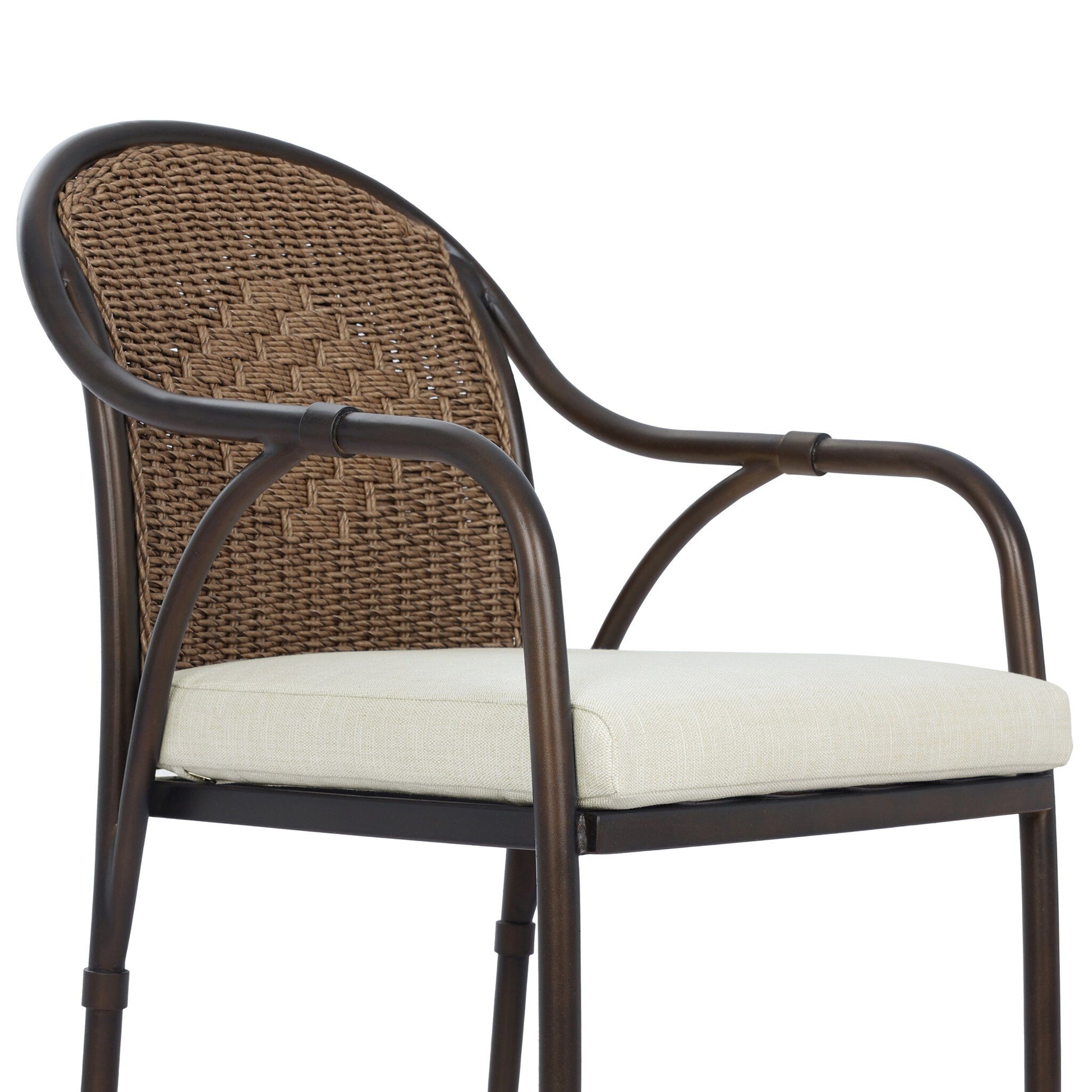 The Graciela Outdoor Dining Chair features a metal frame with curved armrests, a woven rattan backrest, and a light beige upholstered seat cushion. Its overall dimensions are 21.00"w x 22.50"d x 35.00"h.