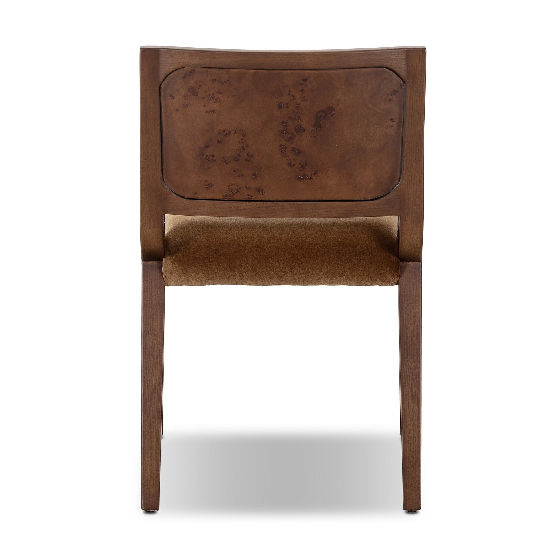 The Corvo Dining Chair, shown from the back, has a rectangular wood-grain backrest, straight legs, and a brown upholstered seat. Its versatile design makes it easy to fit into diverse spaces.