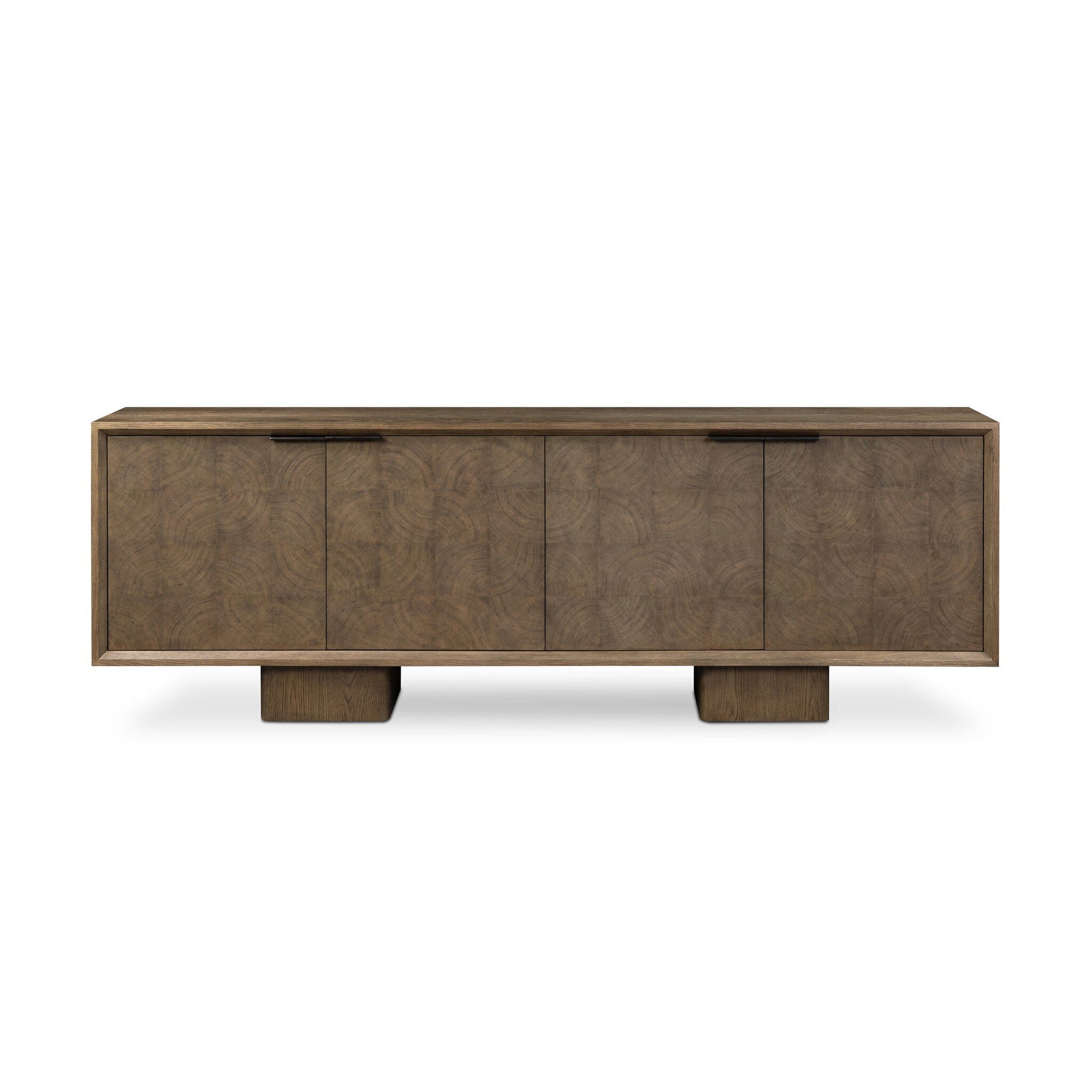 The Salta Sideboard is a modern wooden piece measuring 95.25"w x 20"d x 32.25"h, with a rectangular form, four doors, two block-style legs, minimalist handles, and a natural textured finish.