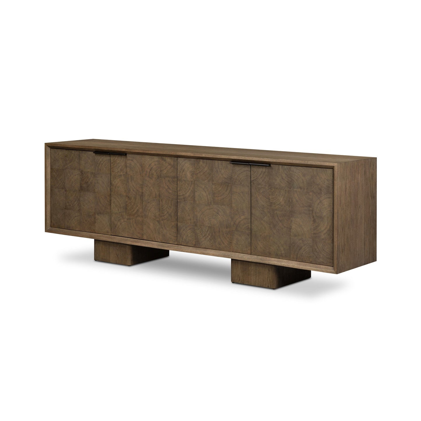 The Salta Sideboard is a modern wooden piece with a rectangular shape, four cabinet doors, two wide block-style legs, and a subtle geometric wood grain pattern. Dimensions: 95.25"w x 20.00"d x 32.25"h.
