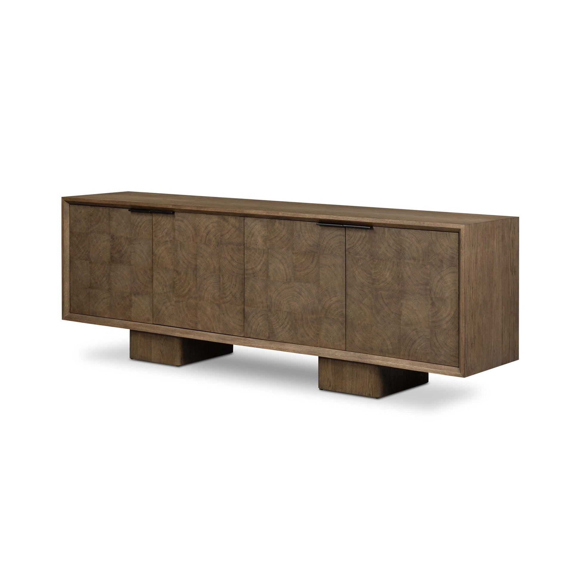 The Salta Sideboard is a modern wooden piece with a rectangular shape, four cabinet doors, two wide block-style legs, and a subtle geometric wood grain pattern. Dimensions: 95.25"w x 20.00"d x 32.25"h.
