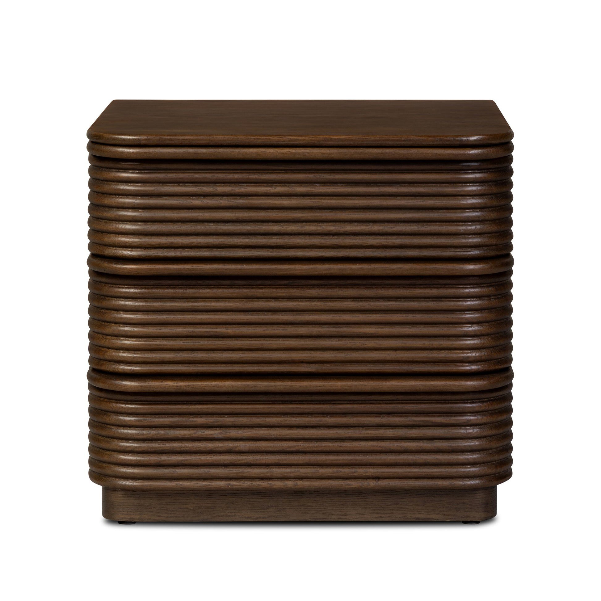 The Benny Nightstand is a dark brown wooden piece with three drawers and a ribbed horizontal groove pattern. Its modern, handleless design measures 26"w x 22"d x 24"h, complementing minimalist spaces.