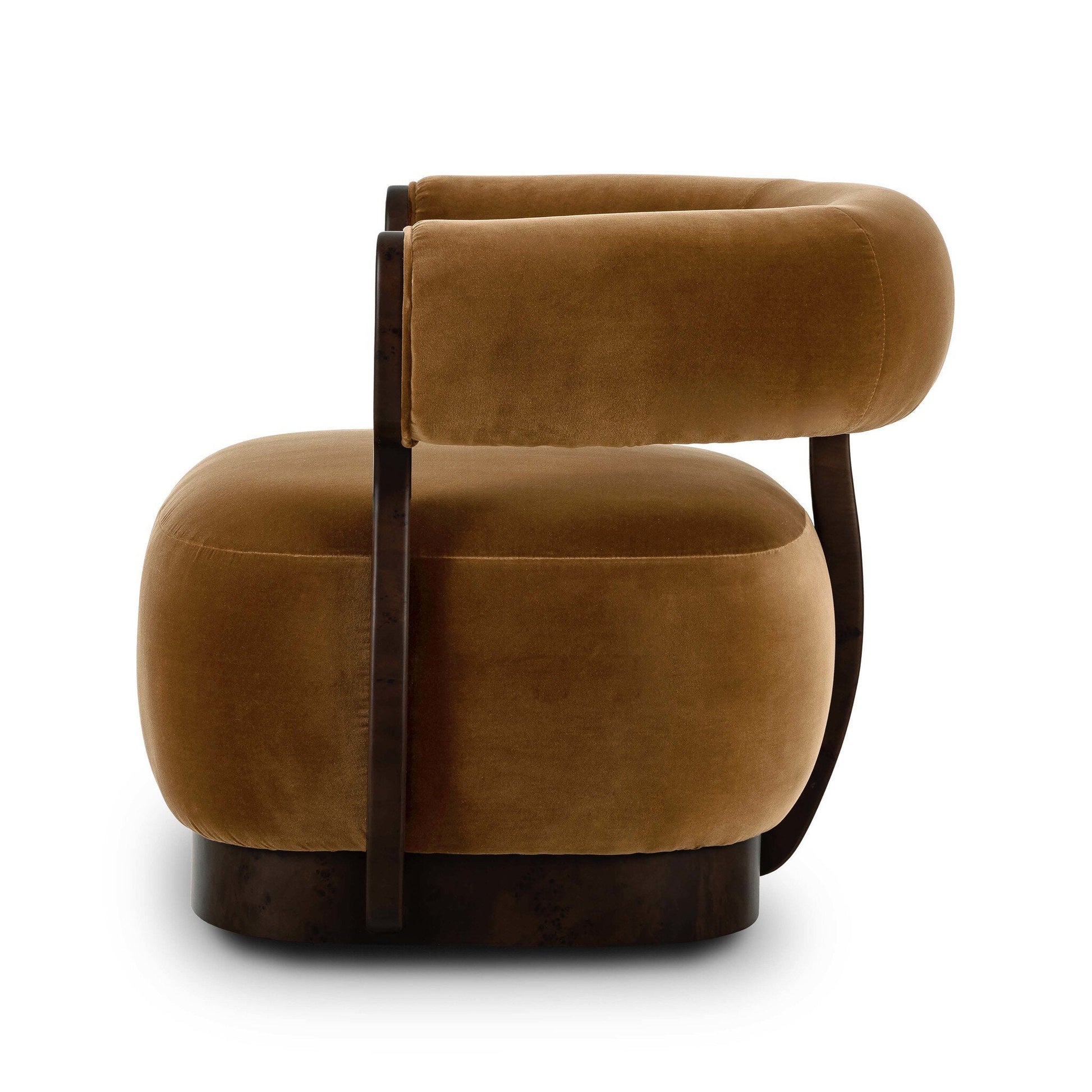 The Yuri Swivel Chair is a modern armchair with plush, rounded cushions in soft brown velvet and a curved wooden frame. Shown from the side on a white background. Overall Dimensions: 34.25"w x 31.25"d x 28.25"h.