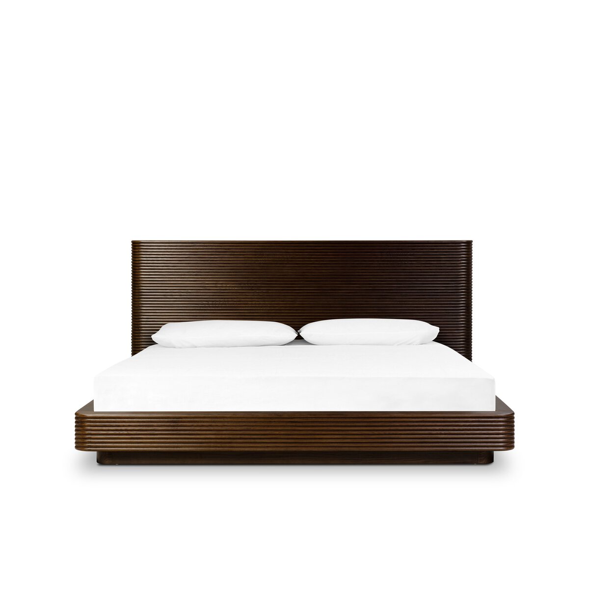 The Benny Bed, a modern dark wood platform bed with a horizontal slatted headboard, white bedding, and two white pillows, is displayed on a white background—ideal for those needing exact furniture measurements.