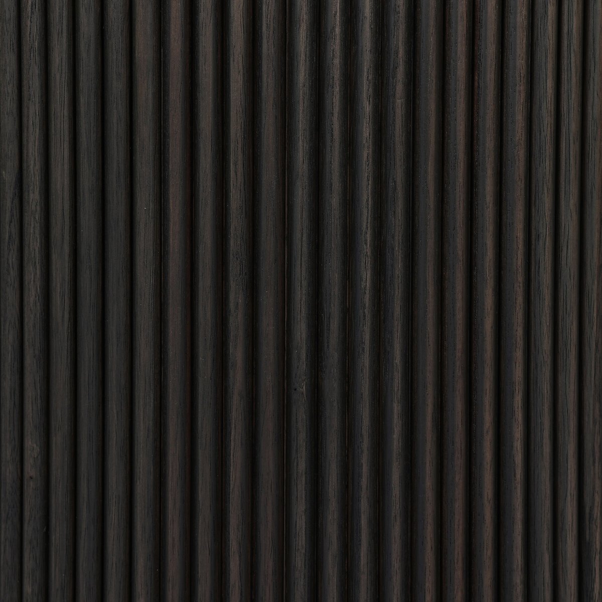 Close-up of the Ona End Table’s dark brown wooden surface, featuring vertical grooves for a ribbed, textured look. The visible wood grain and subtle color variations make it perfect for modern interiors.