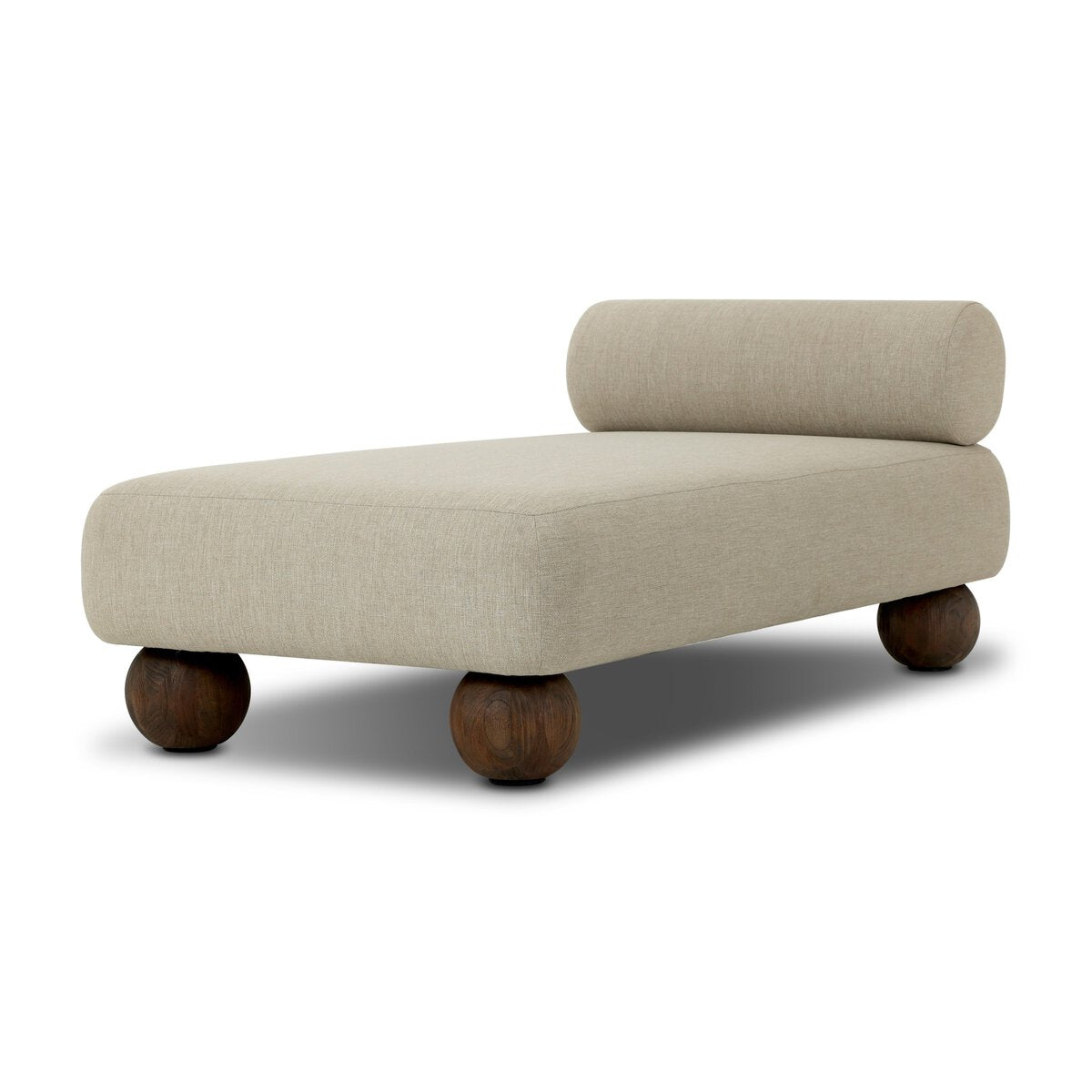 The Leilani Outdoor Chaise is a modern beige upholstered lounge with a cylindrical backrest and four round wooden legs, ideal for relaxing by your workstation or office desk, shown against a white background.