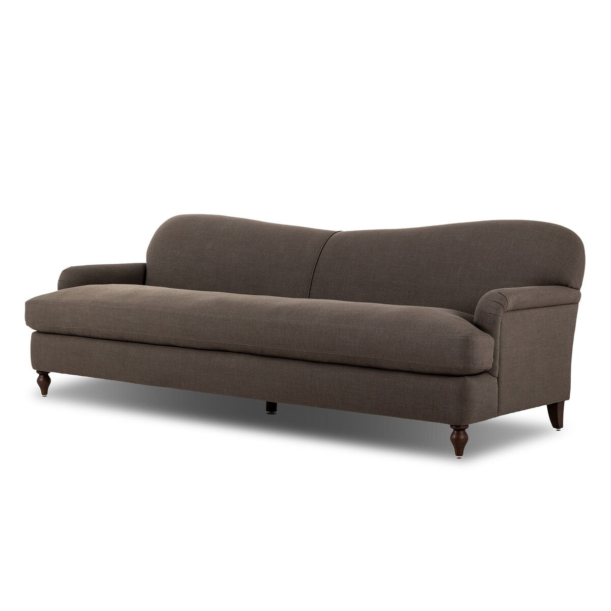 The Tiani Sofa is a dark brown upholstered piece with a curved backrest, slim armrests, and four wooden legs. Its elegant, modern design and compact size make it suitable for various living spaces.
