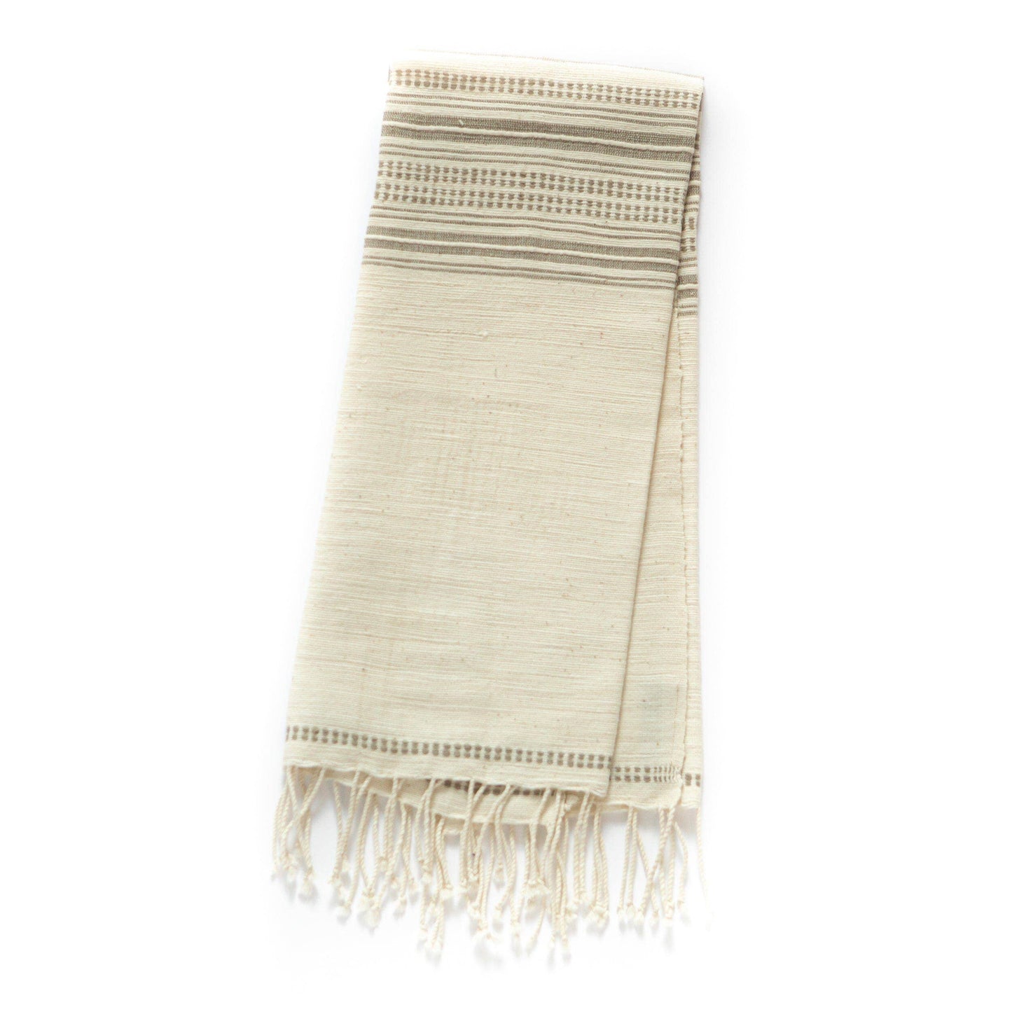 A Handwoven Ethiopian Cotton Hand Towel in cream with subtle horizontal gray stripes and fringed edges, shown folded on a white background.