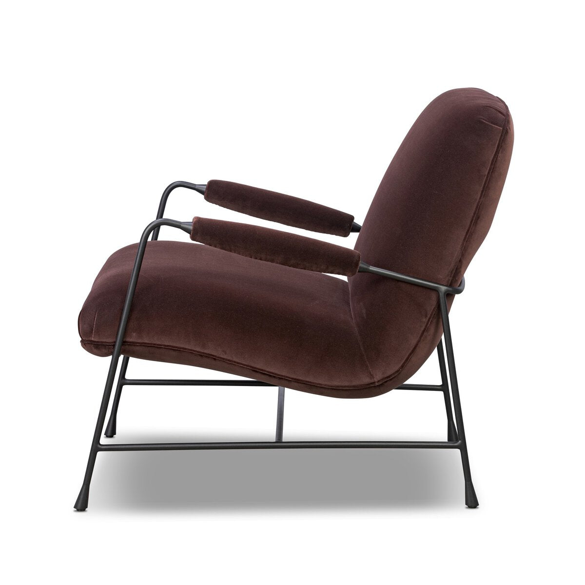 Side view of the Steel Upholstered Armchair showcasing plush brown cushions and armrests on a sleek black metal frame. This minimalist beige accent chair brings contemporary style to any space.