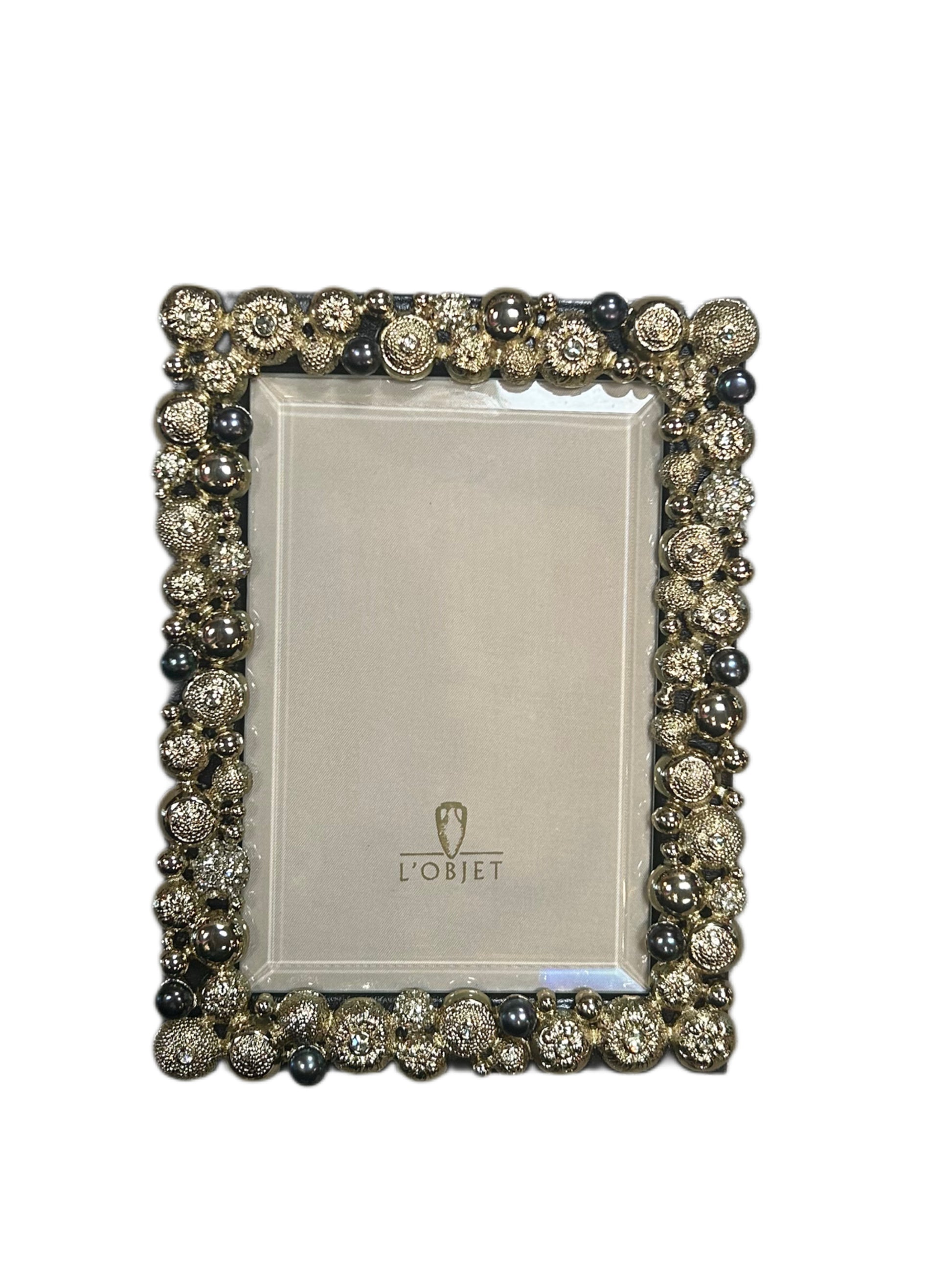 The 4 x 6 - L'Objet Photo Frame features an ornate rectangular design with metallic beaded accents and small spheres, a central blank space, the L'Objet logo at the bottom, and is set against a plain white background.