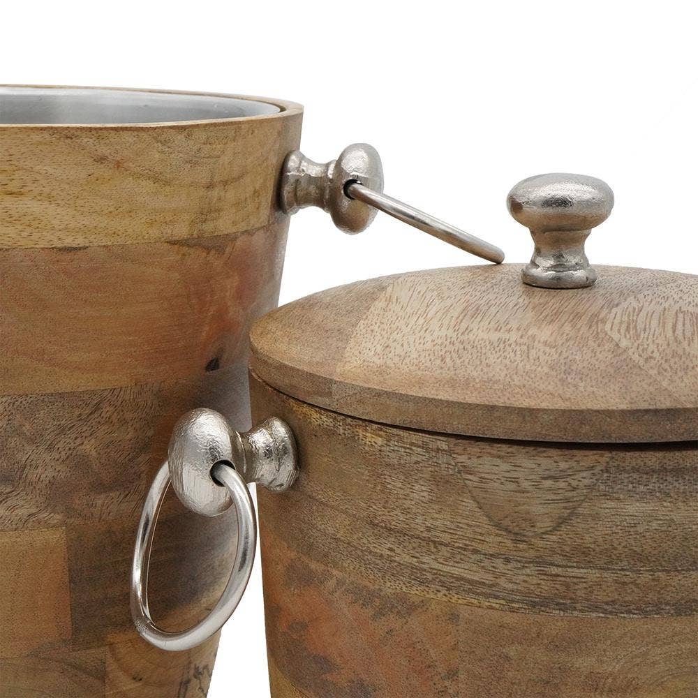 The Mango Wood Bar Buckets (Set of 2) feature silver metal handles and lids. One bucket is closed with a knob, while the other is open to reveal a metal-lined interior ideal for use as bar buckets or a beverage cooler.