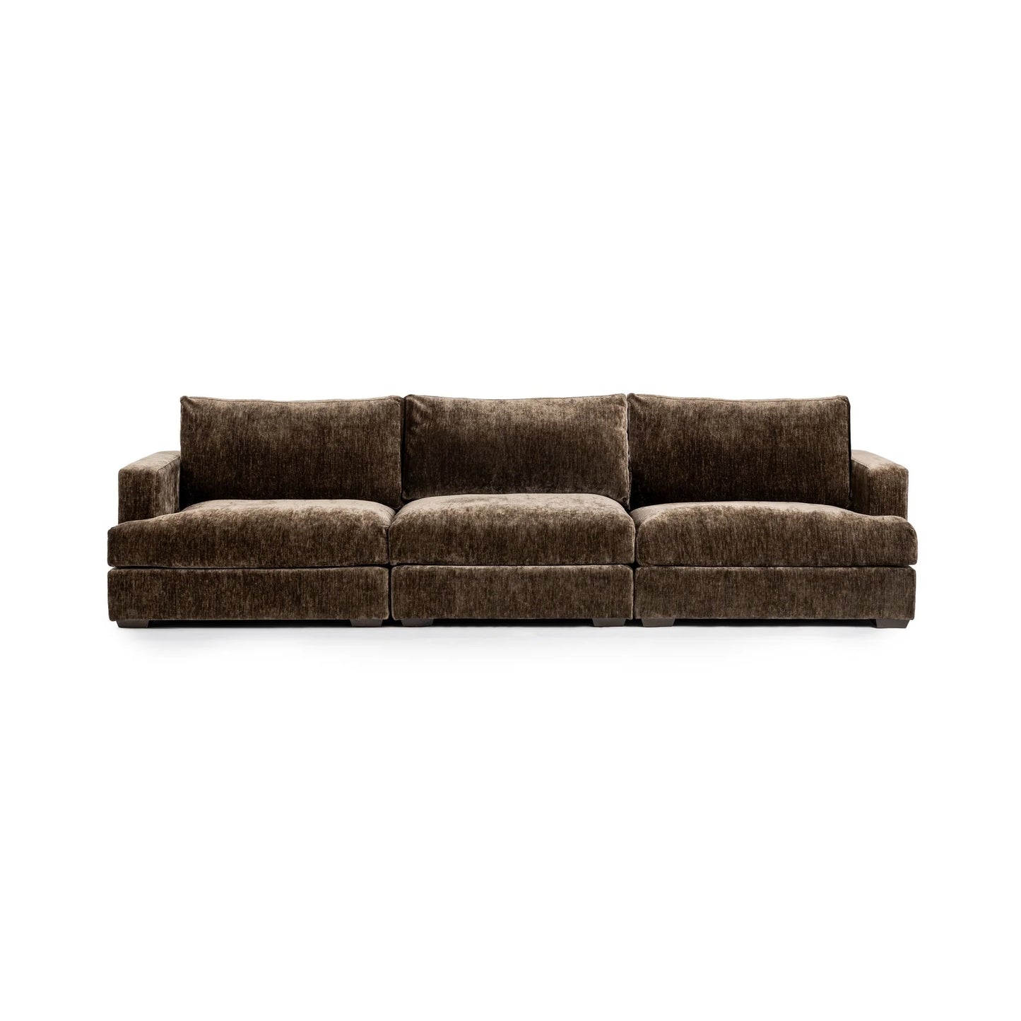 The Mossed Brown 3pc Sofa is a spacious, three-seat sofa crafted in brown fabric with plush cushions and low square arms, shown here against a plain white background.