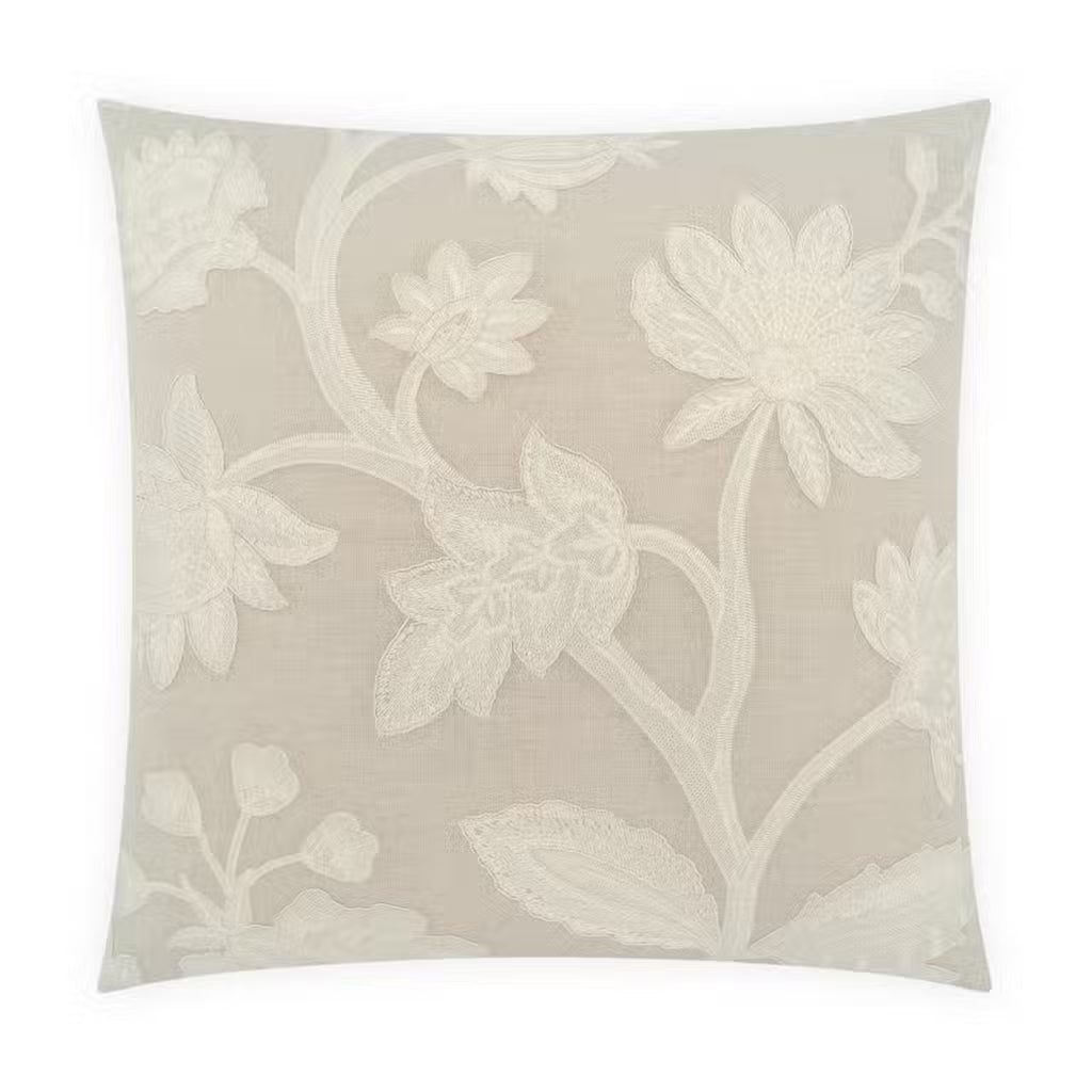 Introducing the Garden Pillow: a square beige linen accent pillow adorned with an elegant and delicate embroidered white floral and leaf pattern, showcasing large blooming flowers and leafy stems across the entire surface. This beautiful pillow comes complete with a plush feather insert for enhanced comfort and support.
